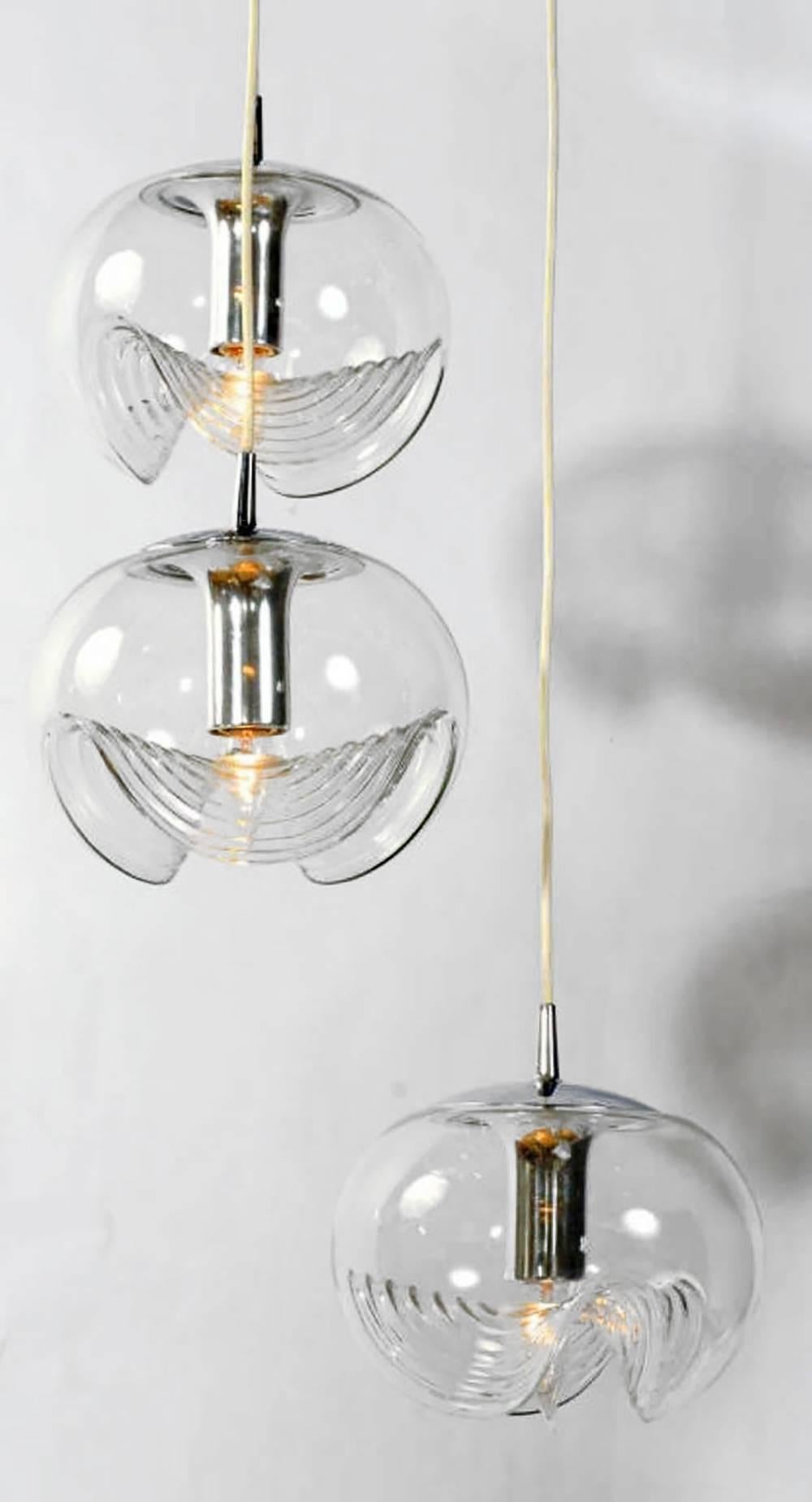 Triple blown glass globe pendant light by Koch and Lowy. 10