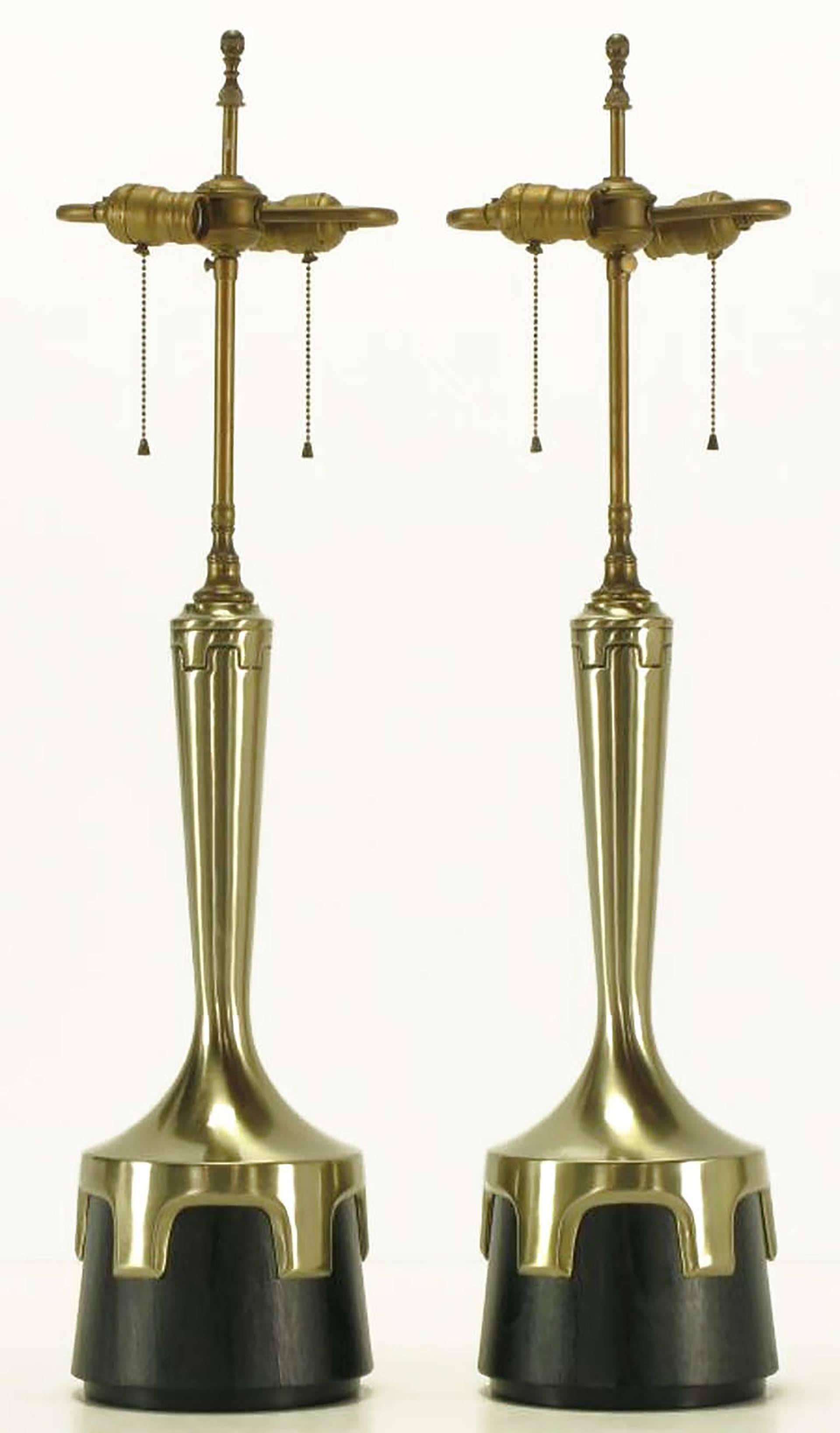 Pair of early Frederick Cooper aged nickel (not brass) and ebonized walnut table lamps. Nickel-plated bodies with inverted crenellations clasping ebonized veneer bases. Incised decoration encircling the necks echoes the crenellated design. Double