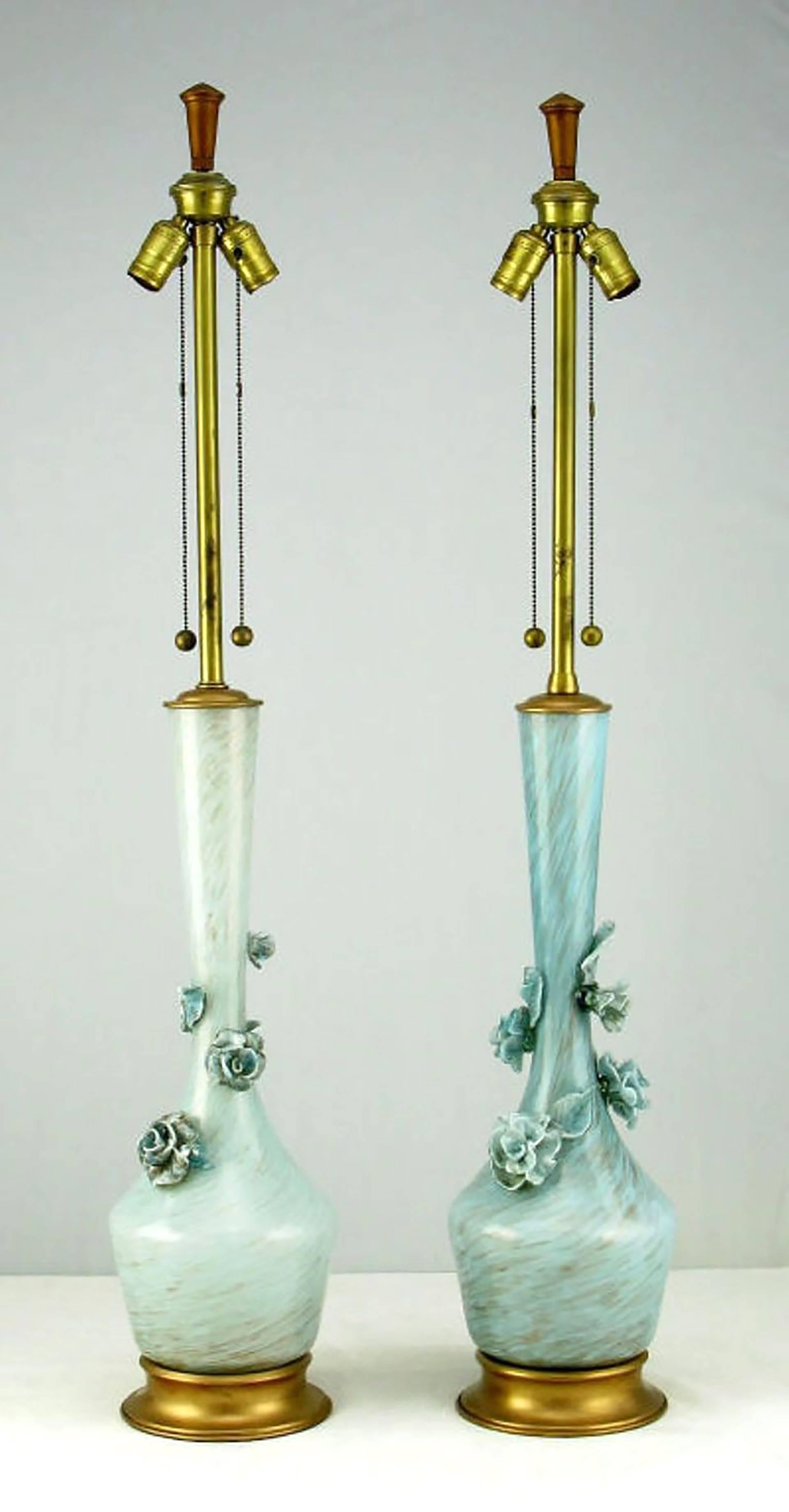 Pair of large blue handblown Marbro table lamps. Blue Murano handblown glass bodies have internal flecks of gold. Gold leafed brass caps and bases. Each lamp adorned with blue glass flowers and leaves. handblown glass can have some color variation