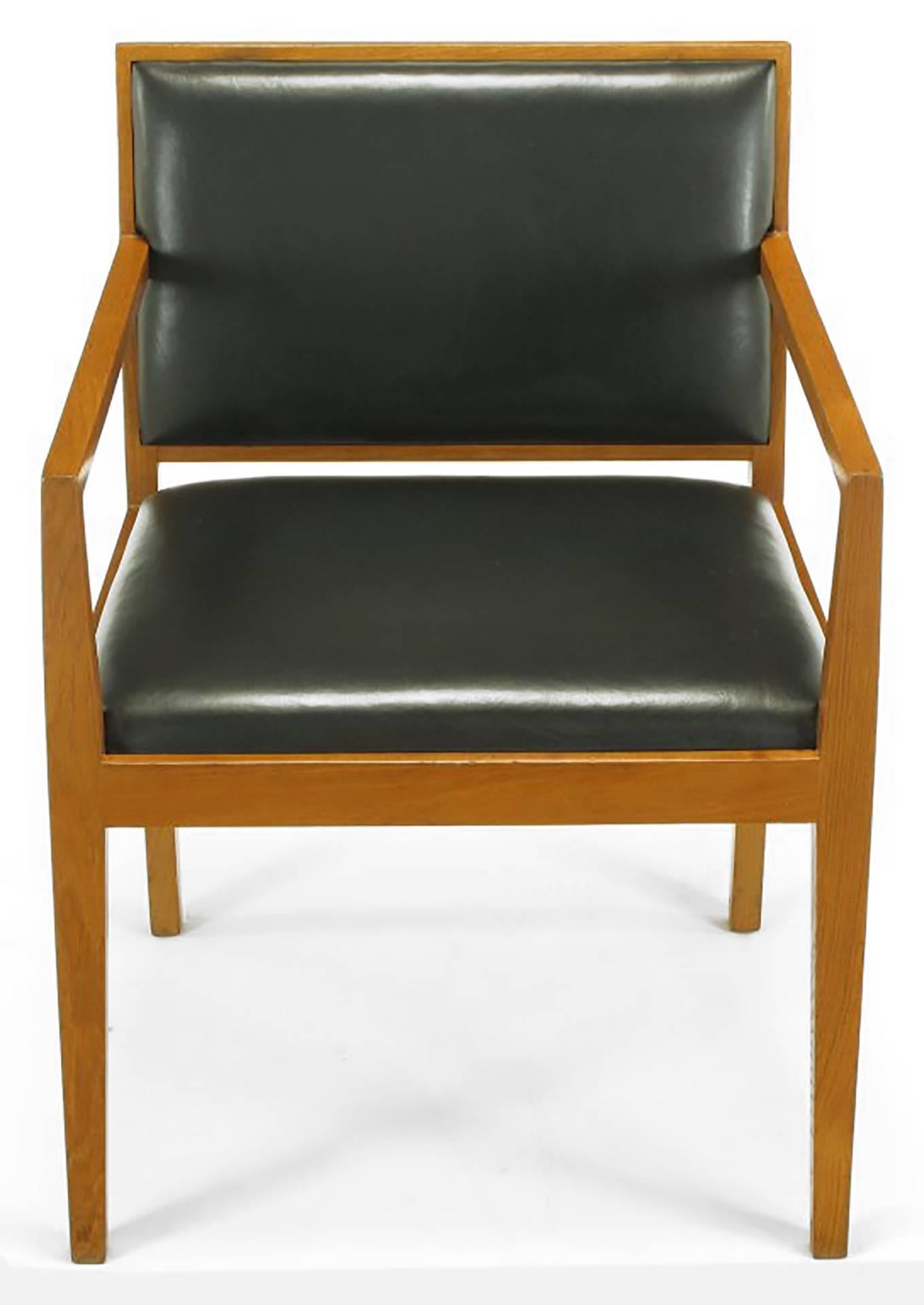 Set of four ashwood and dark chocolate leather armchairs by Interior Crafts of Chicago, custom furniture maker to the trade. Possibly a Bert England design who, along with Richard Himmell among others, designed for Interior Crafts in the 1960s.