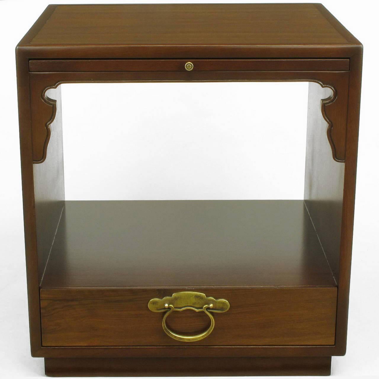 Pair of Bert England for Widdicomb nightstands with single drawer, pull-out righting surface and open shelf. Constructed of solid mahogany edging and East Indian Laurel wood veneer with large drop pull to the drawer and button sized pull for writing