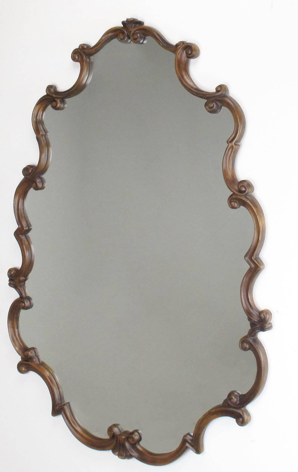 Large French Regency style fruitwood framed mirror. Excellent workmanship with a wood backing and expertly carved scrolled fruitwood frame. Measure: 53