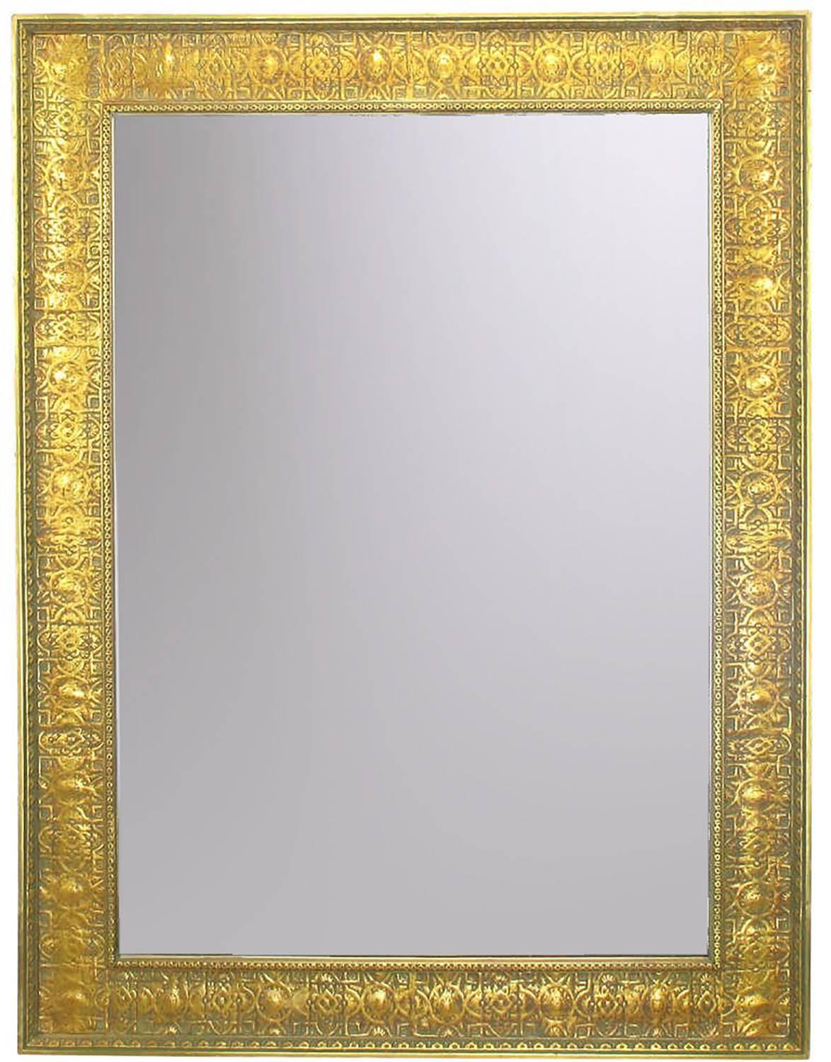 Pair of large gesso and wood framed wall mirrors with Egyptian motif. No doubt inspired by Howard Carter's 1922 discovery of King Tut's tomb. One mirror shows more bole through the gold leaf than does the other. Minor repairs and touch ups to both
