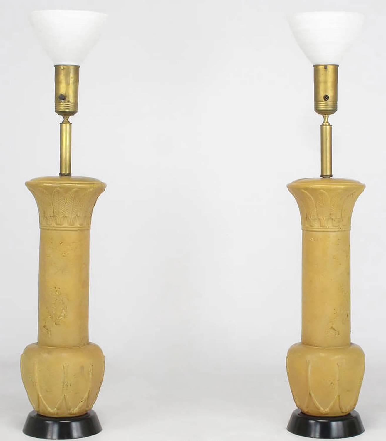 Reminiscent of some Frances Elkins design lamps, this monumental pair have terra cotta glazing over cast plaster, black lacquered plaster bases, brass stems and cups, with white milk glass diffuser. Original shades are woven of bamboo and wool.