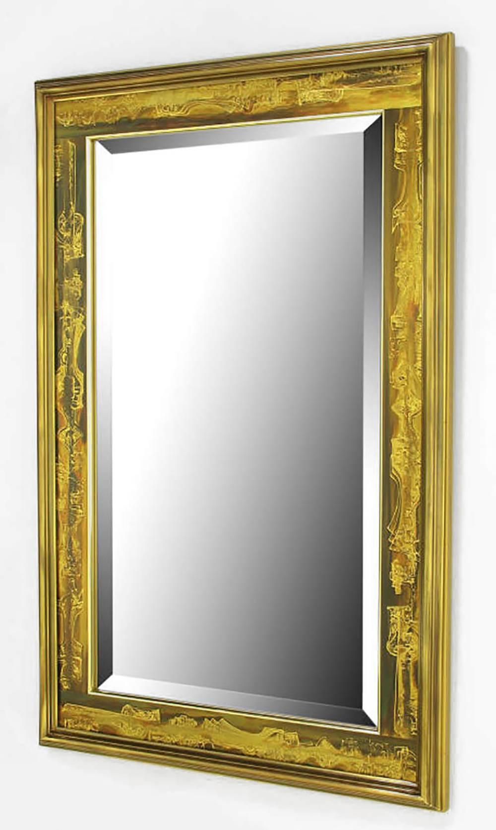 Bevelled mirror with a Mastercraft, Bernhard Rohne designed acid etched panel and bevelled solid brass frame. Backed by a gold lacquered wood panel.