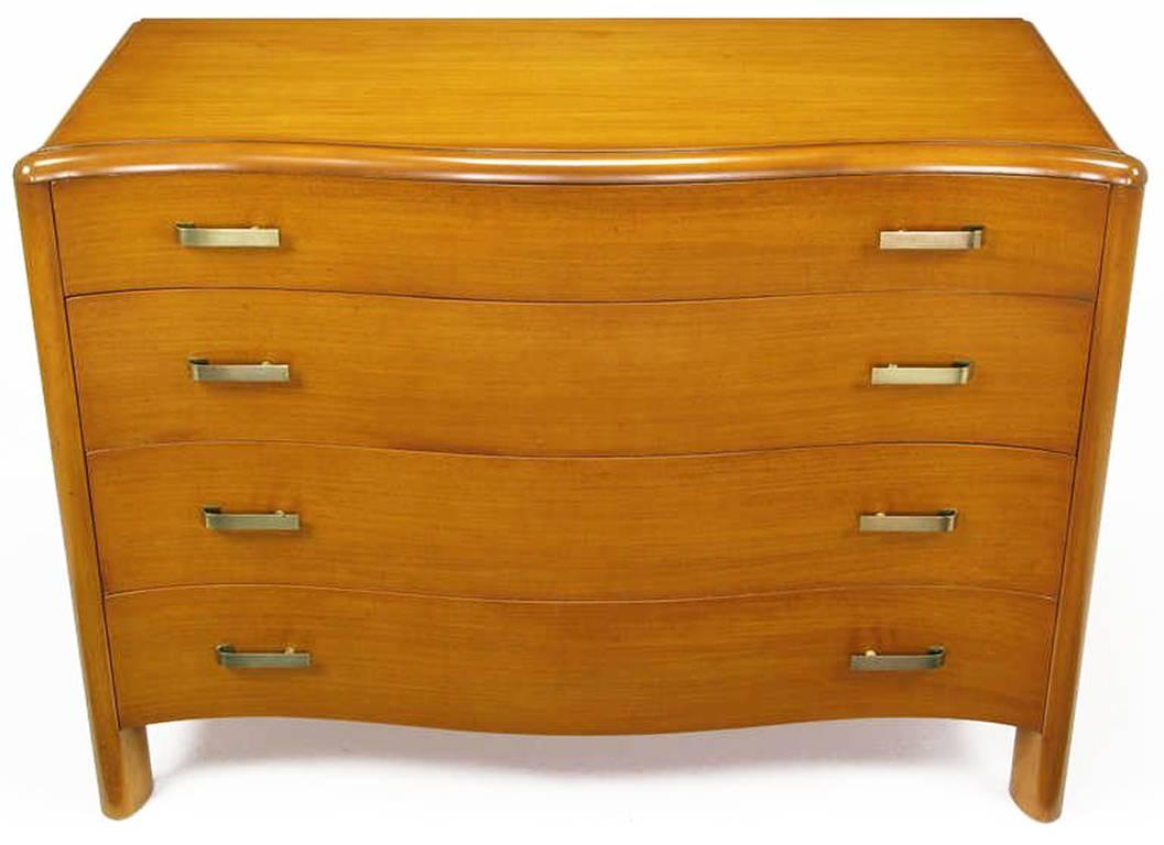 Bleached and toned mahogany four-drawer commode by the fine furniture maker, Empire Furniture Company of Rockford, Illinois. Serpentine front is set off by canted front legs and brushed brass ribbon pulls with red and yellow veined Bakelite spacers.
