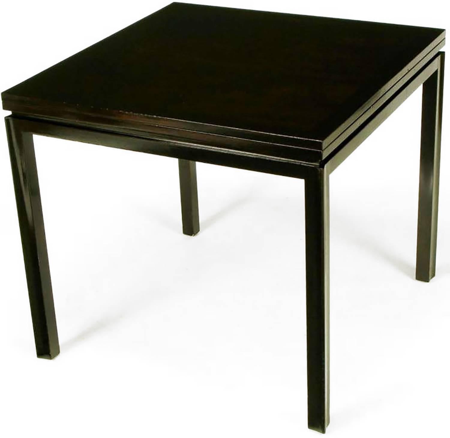 Edward Wormley for Dunbar #2299 ebonized walnut flip-top game table, with ebonized mahogany skirt and reverse quatrefoil legs. Top rotates and flips to convert to a dining size tabletop of 64