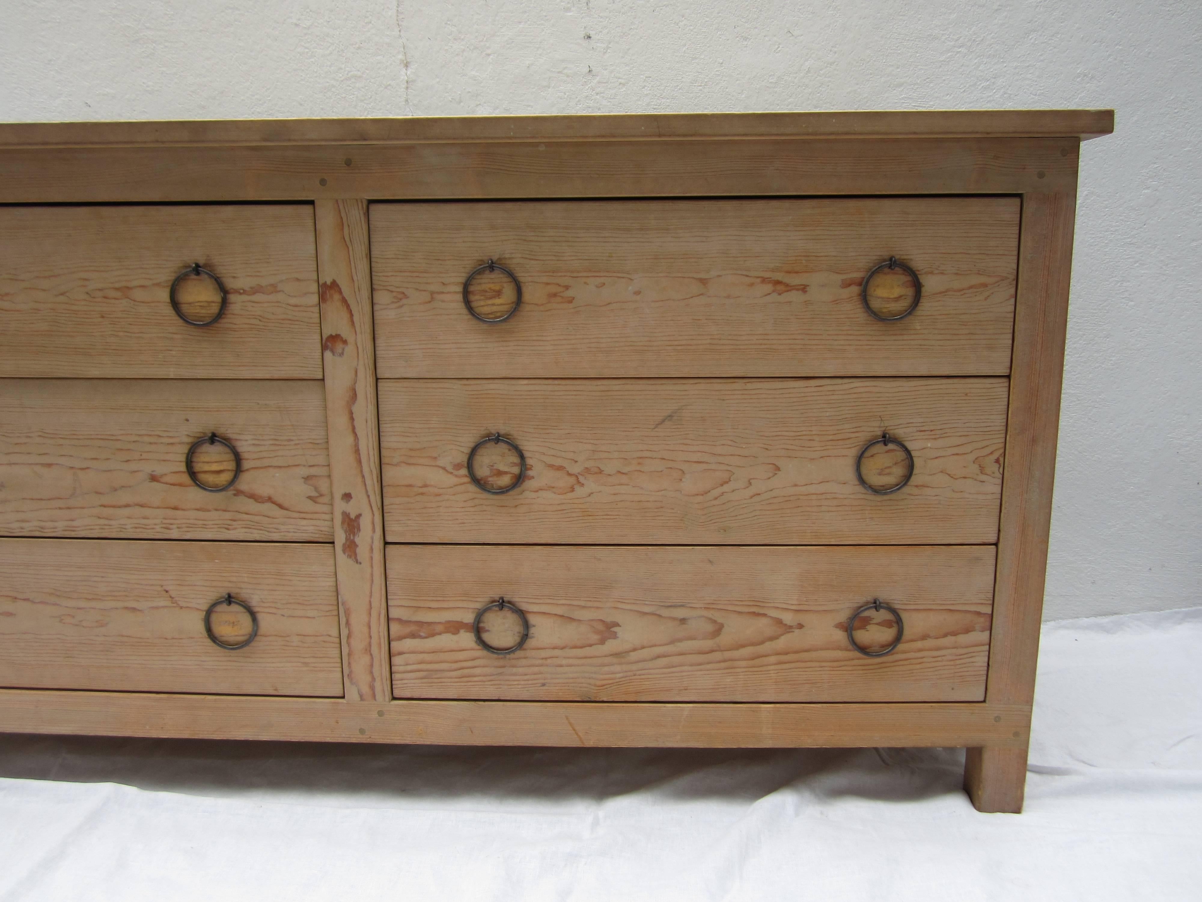 Pine chest of drawers with ring pulls.