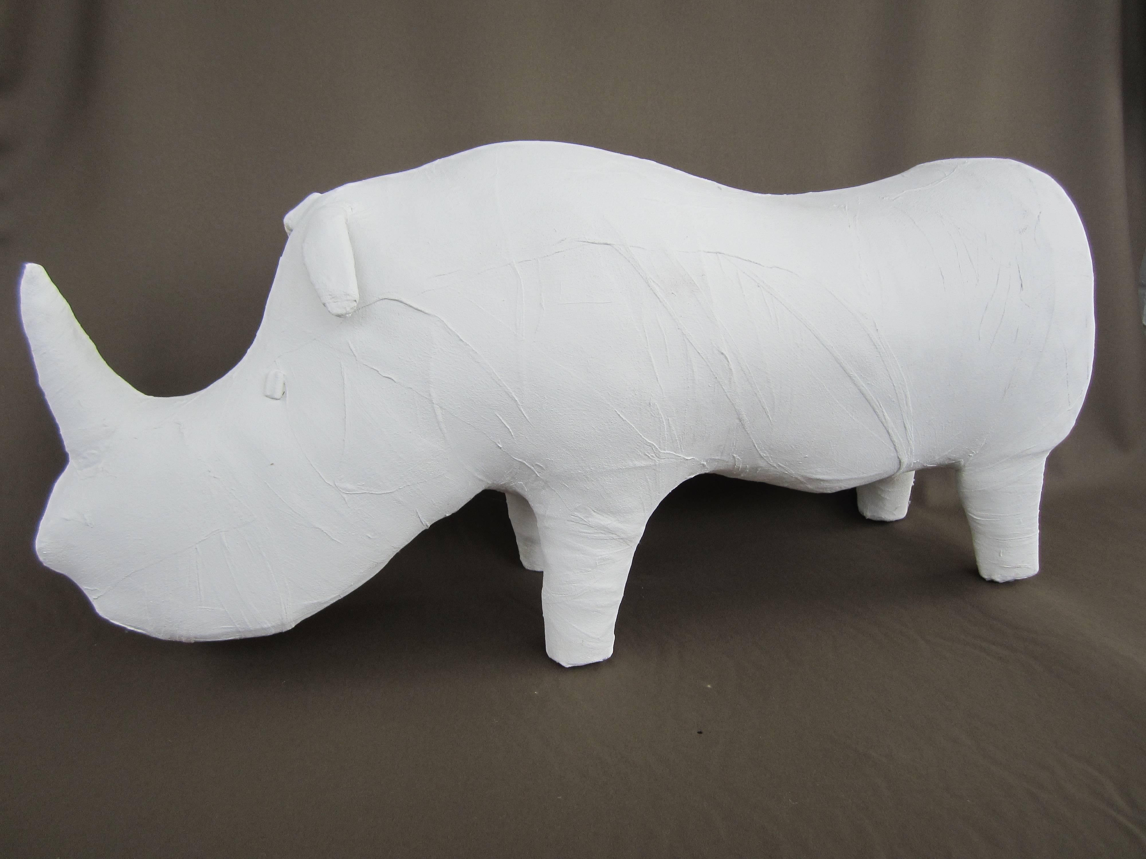 Original leather Abercrombie and Fitch rhinoceros "mummified" using gauze and gesso.