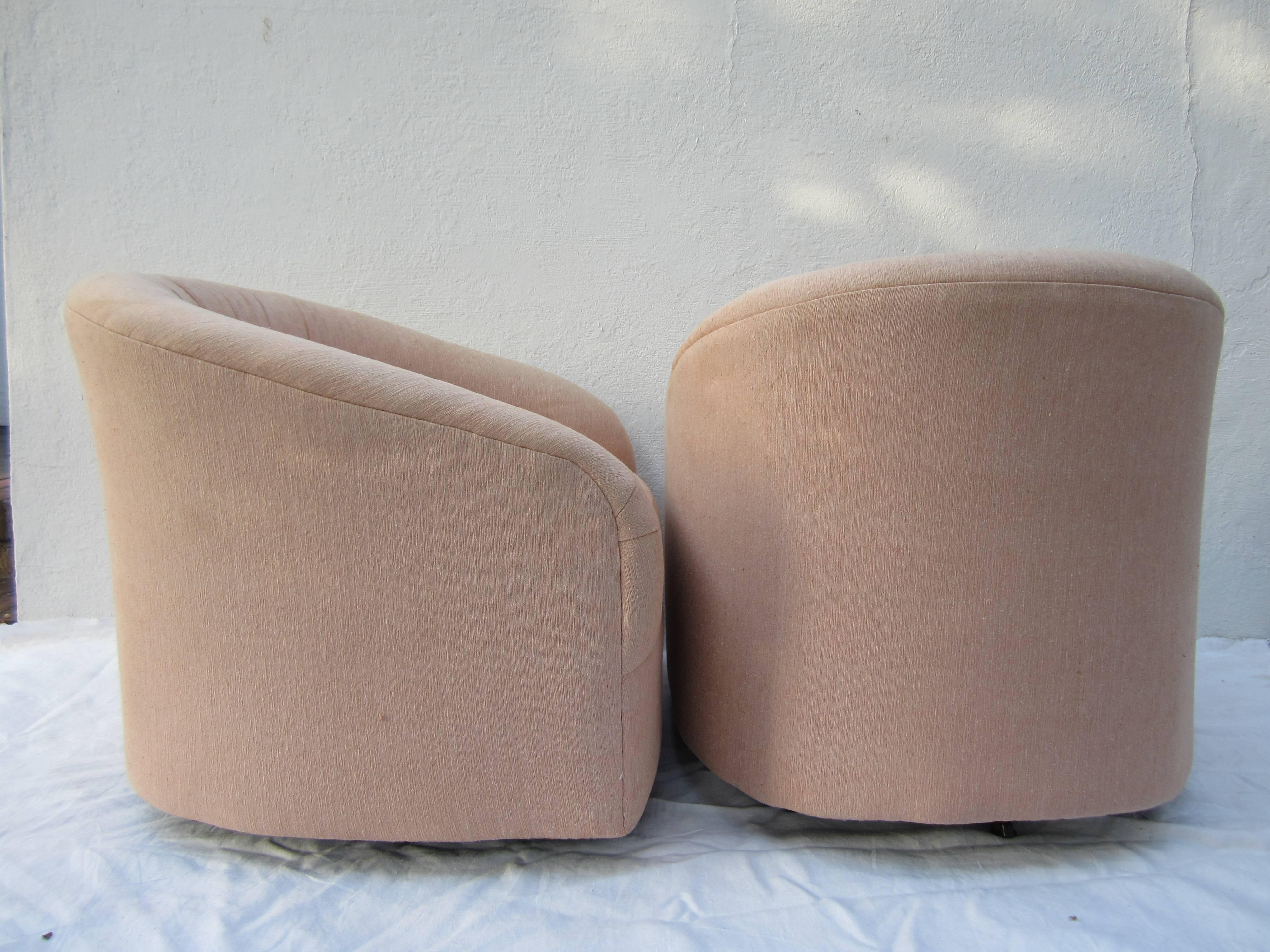 Pair of swivel chairs attributed to Milo Baughman in original upholstery.
