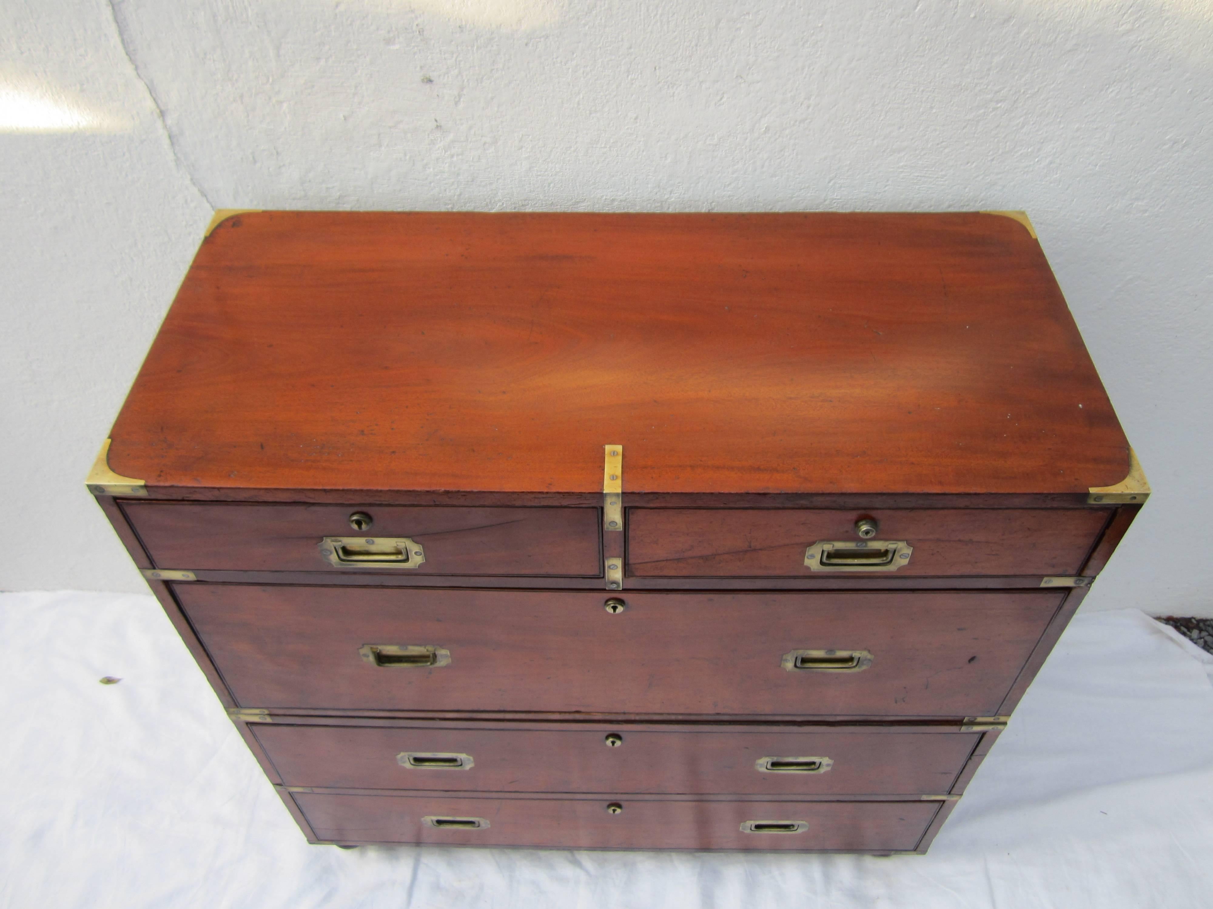 Very special and beautiful 19th century English Campaign chest in two parts with brass hardware stamped London.