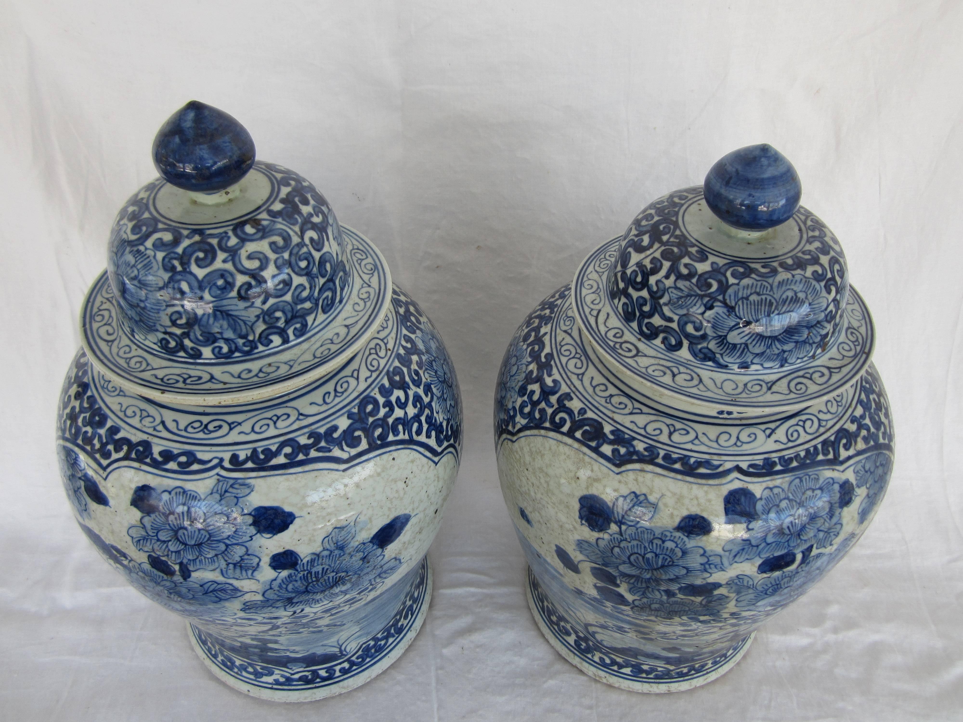 Pair of Chinese blue and white vases with lids.