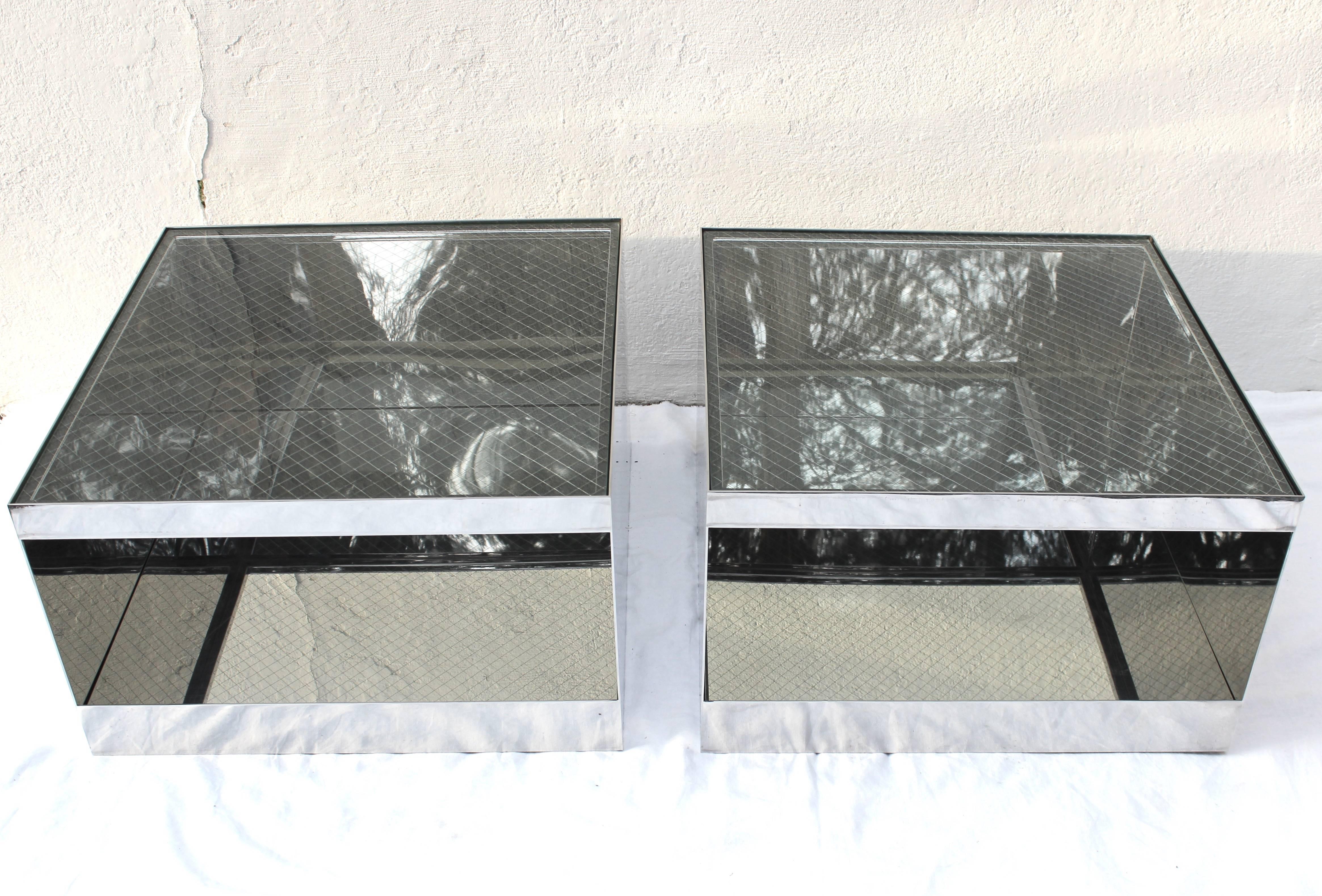 Great pair of polished steel side tables by Joe D'urso with original safety glass.