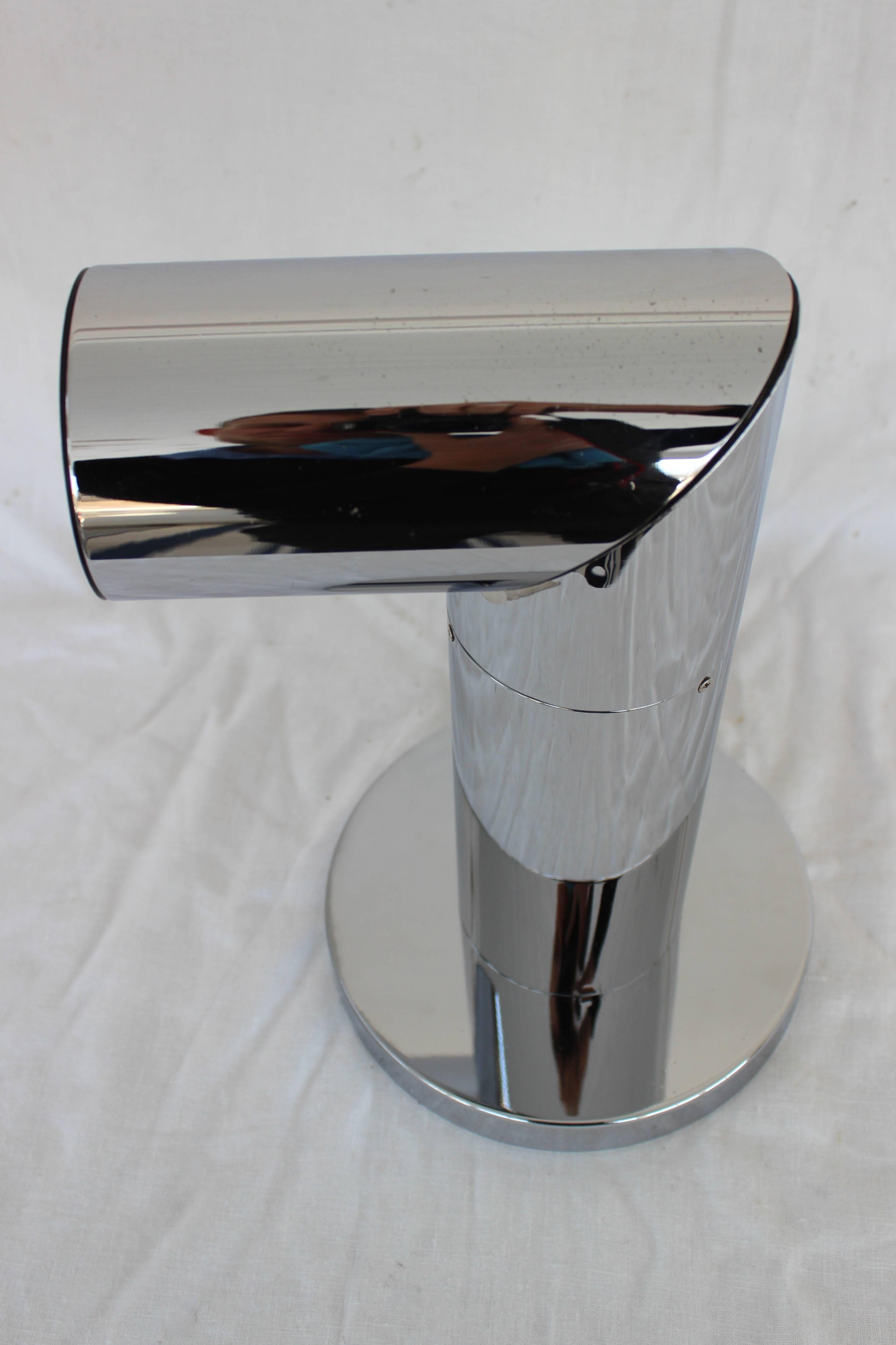 Chrome table lamp with adjustable nose (see on photographs) in the style of Arredoluce

Twisted: 9" W x 8" D x 13.5" H
Straight up: 8" dia x 17" H.