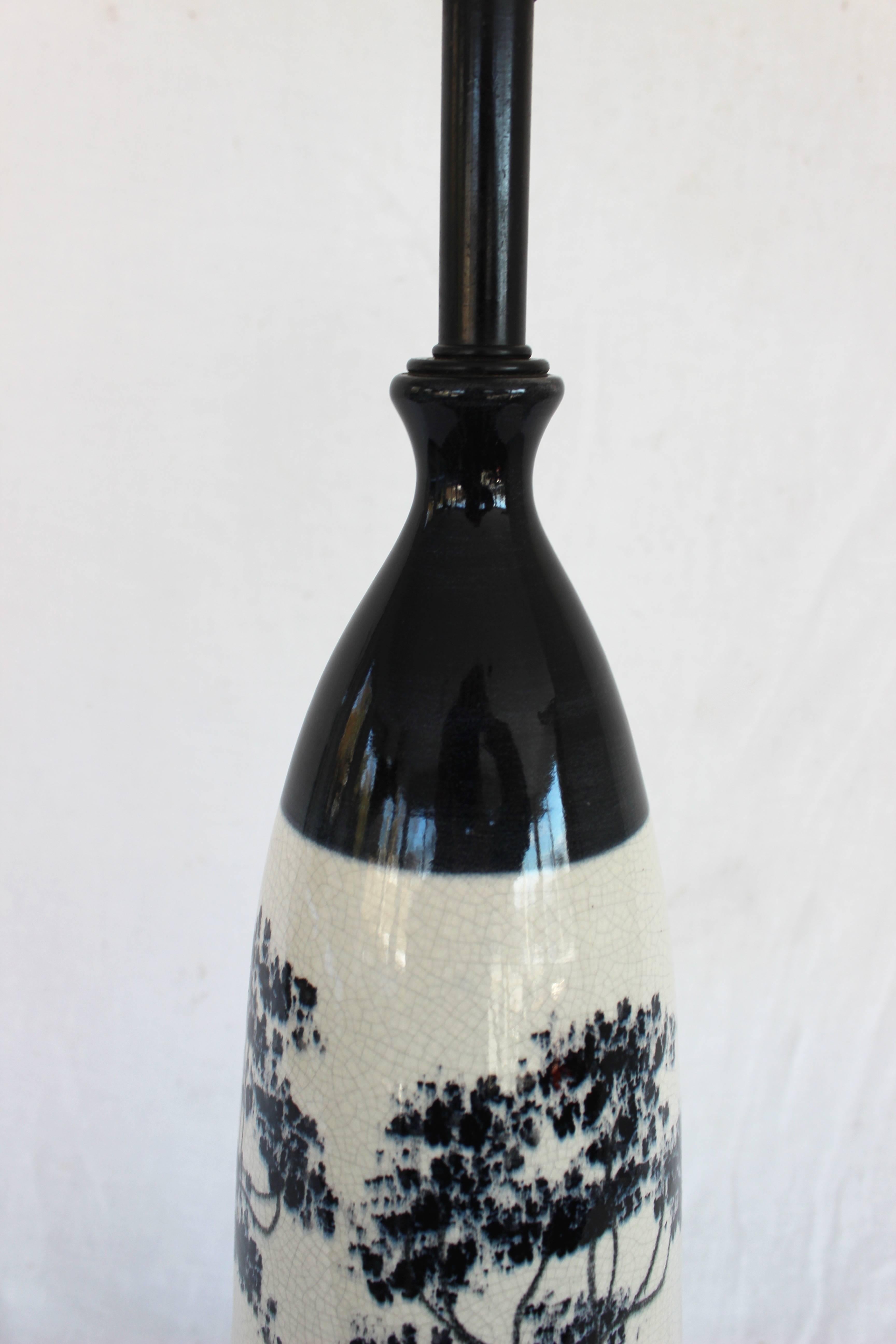 Crackle glaze painted ceramic lamp.

Measures: 27