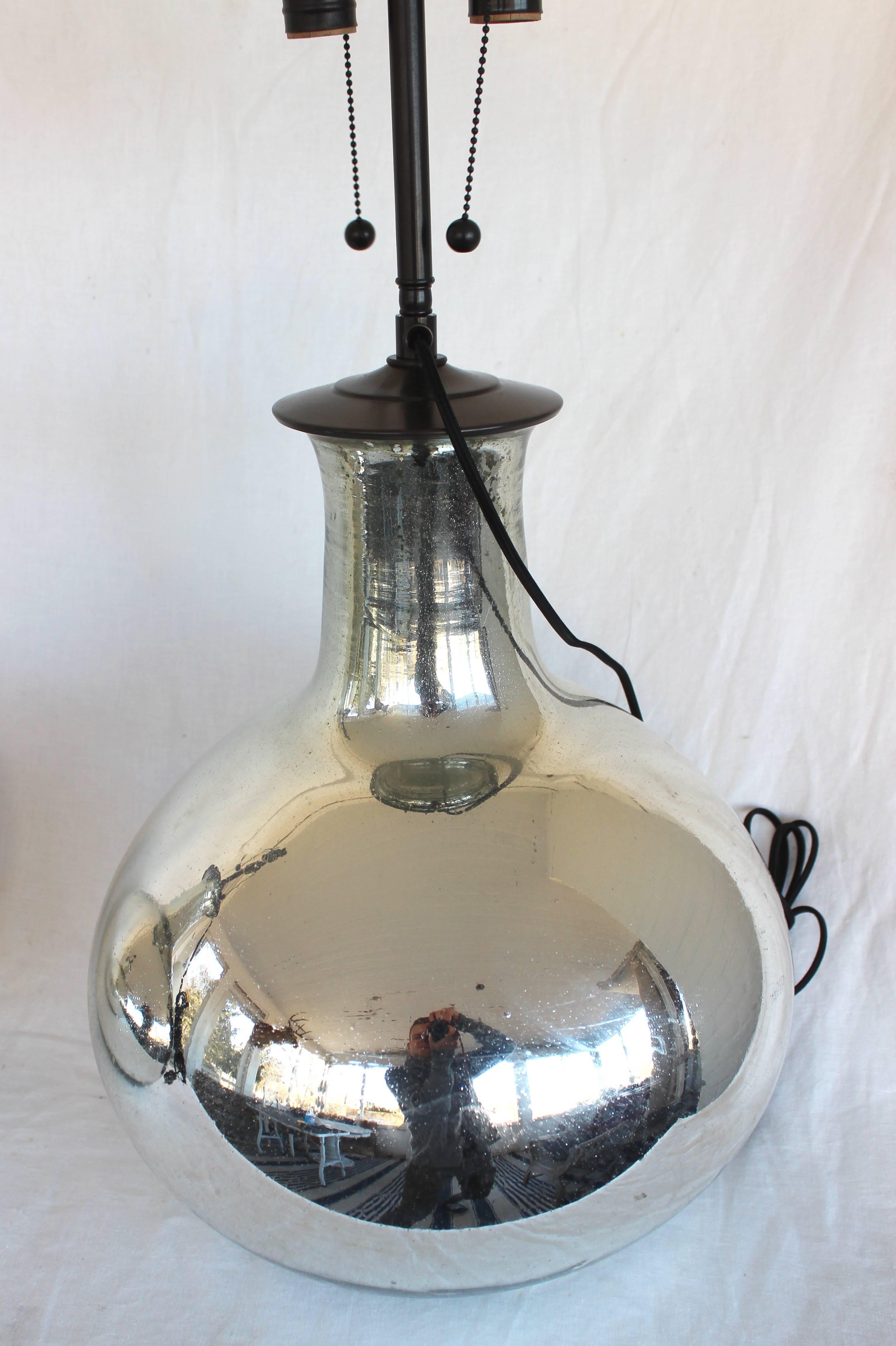 Pair of large mercury glass lamps. All new electrical wiring, sockets, etc.

Measures: Mercury glass height 17