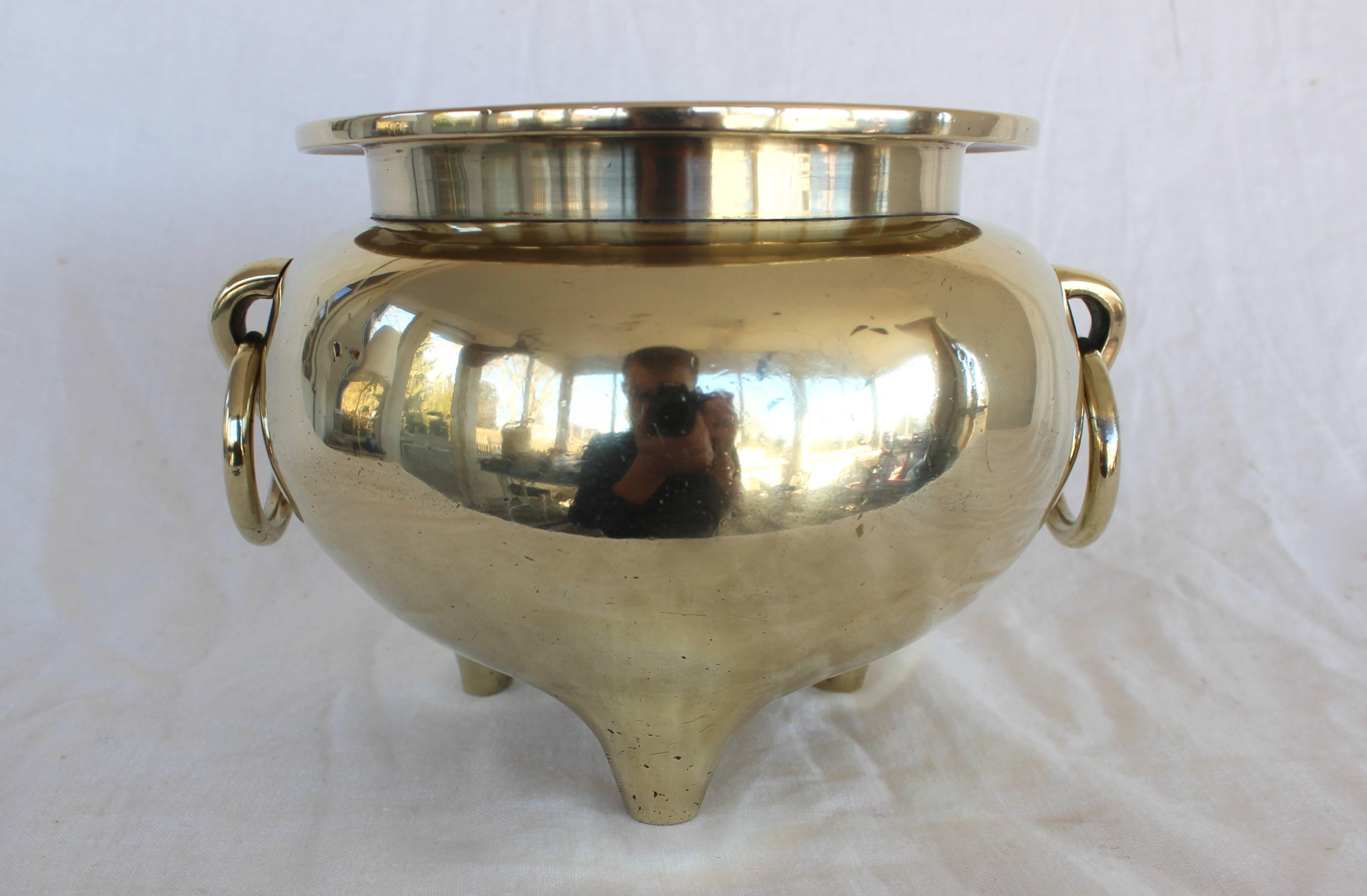 Substantial solid brass cachepot perfect for your beautiful orchid. 8.6 lbs.! Three legs with loose ring handles. Would look at home in both modern and traditional spaces.