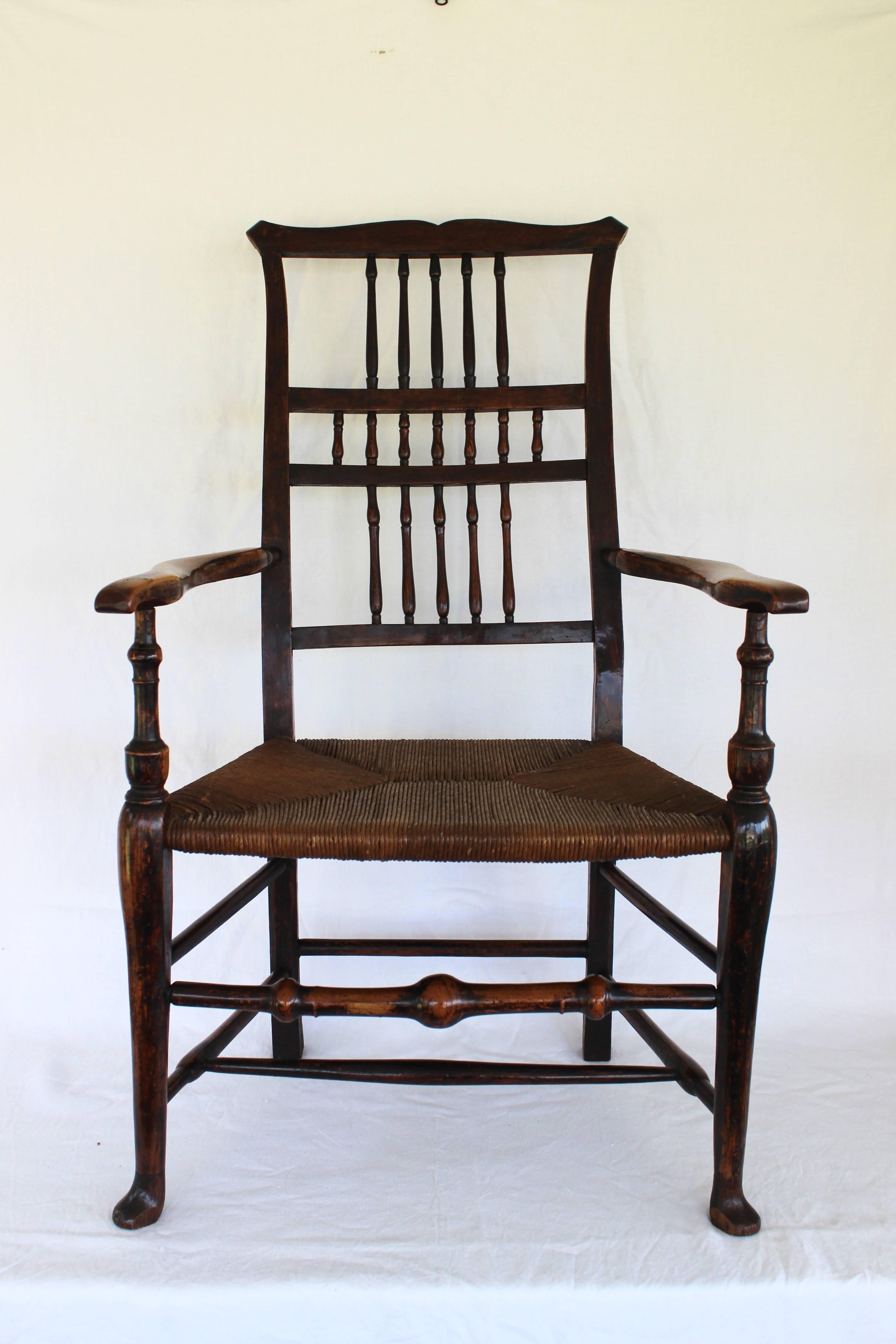 18th century English spindle back armchair with rush seat.