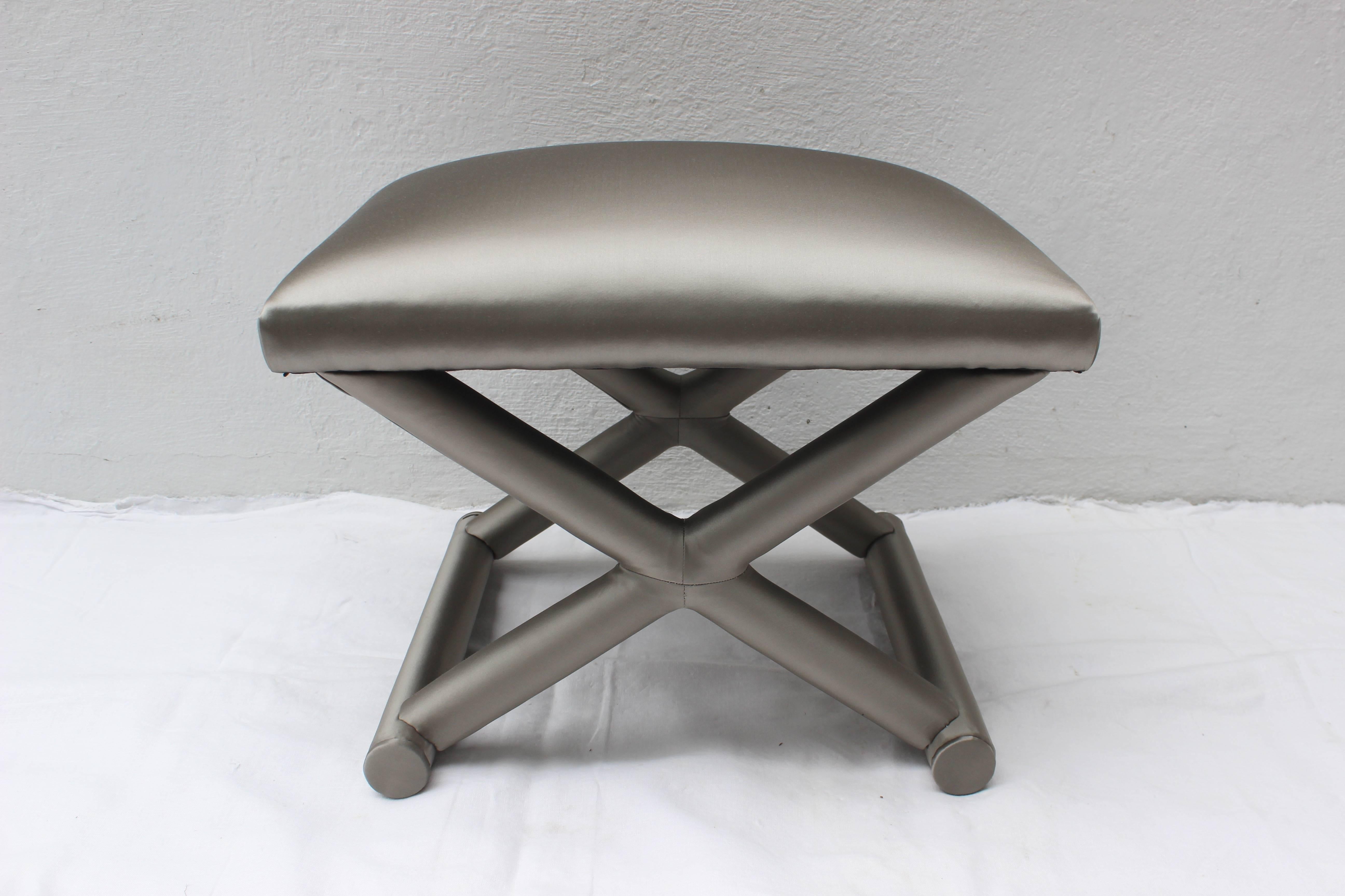 X-bench stool in new grey satin upholstery.