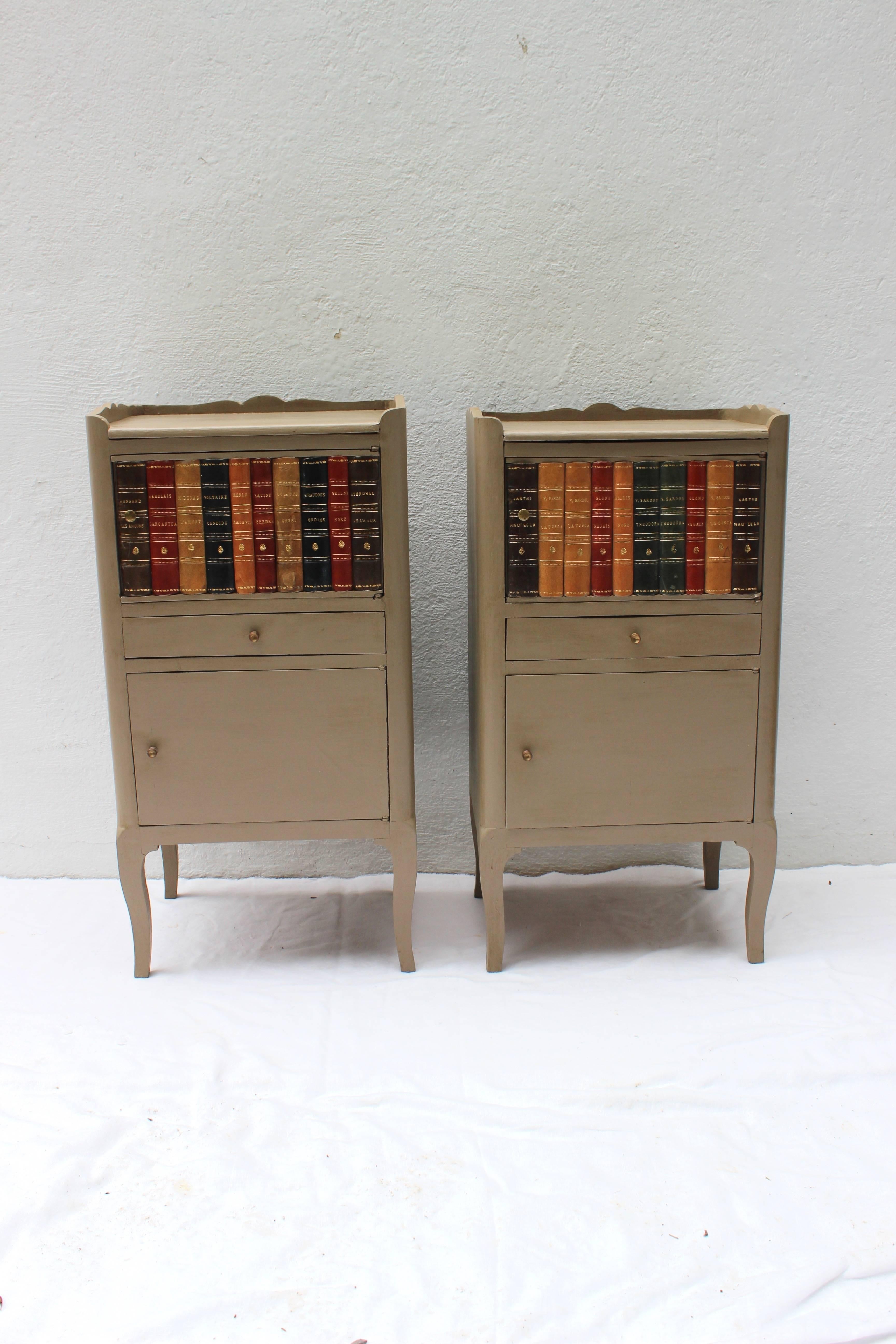 Pair of Louis XV style nightstands with book spines adhered to the doors.