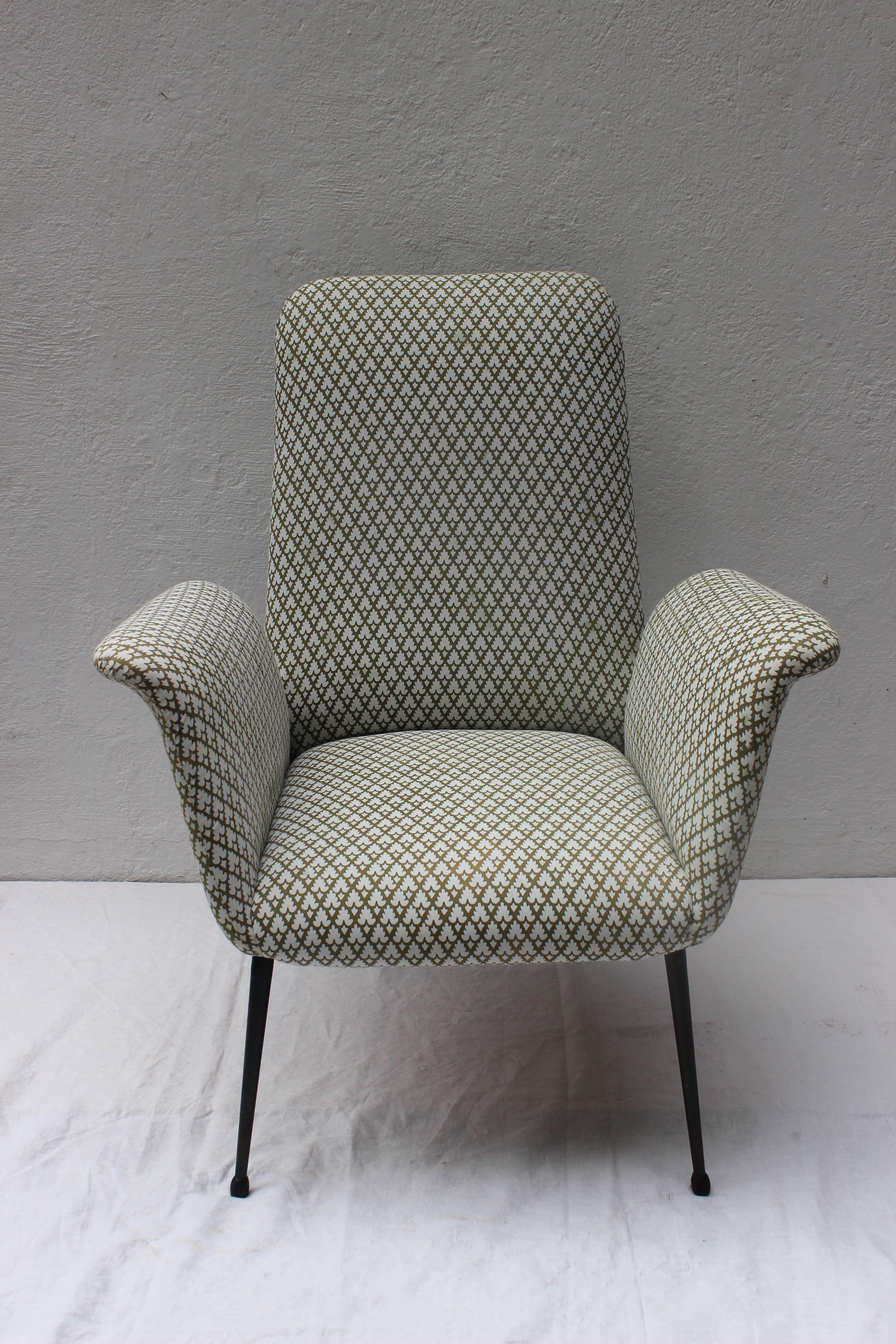 Chic Italian Mid-Century arm chair with floating arms, newly upholstered in Fortuny fabric.