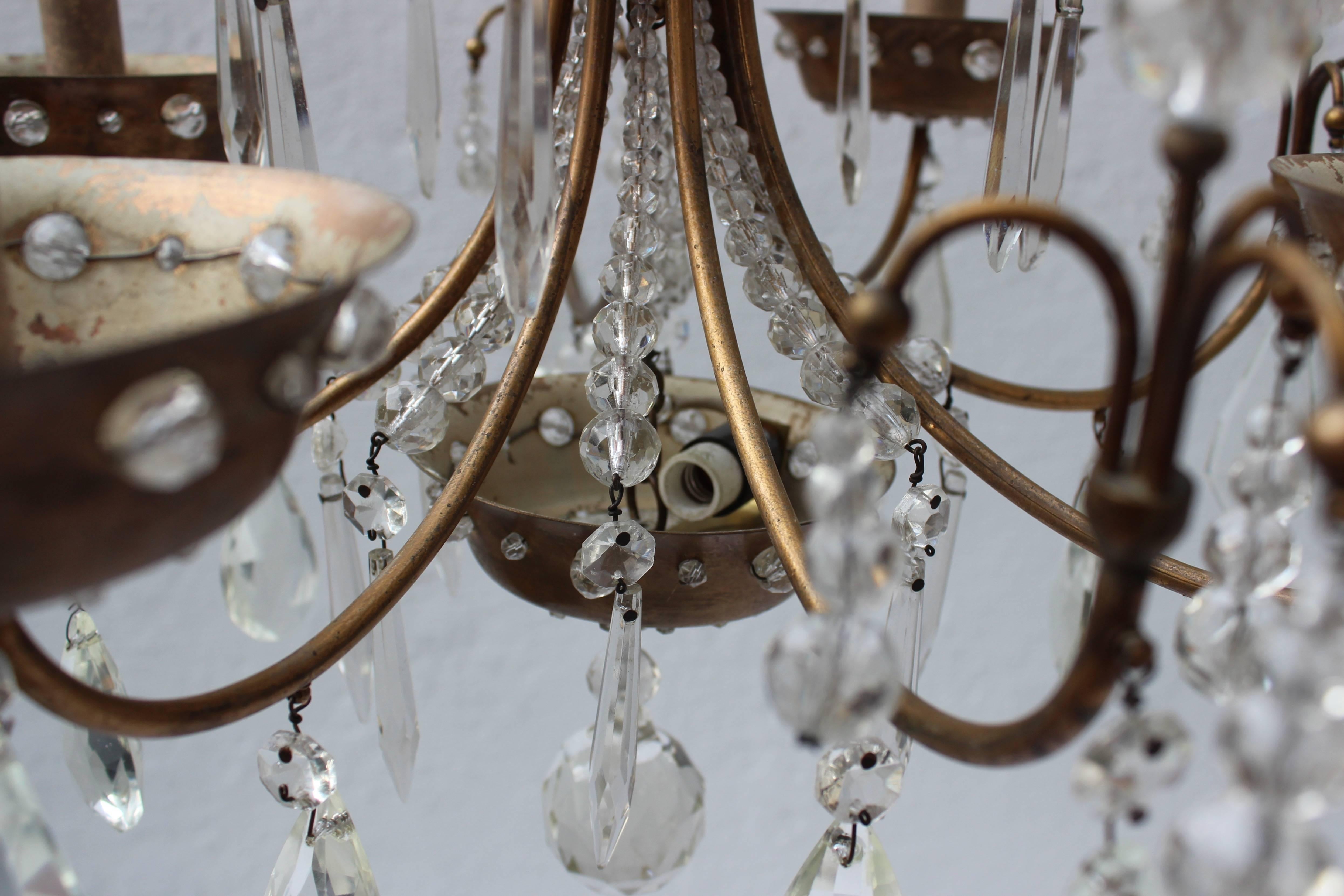 Mid-20th Century Maison Jansen Four-Arm Brass and Crystal Chandelier For Sale