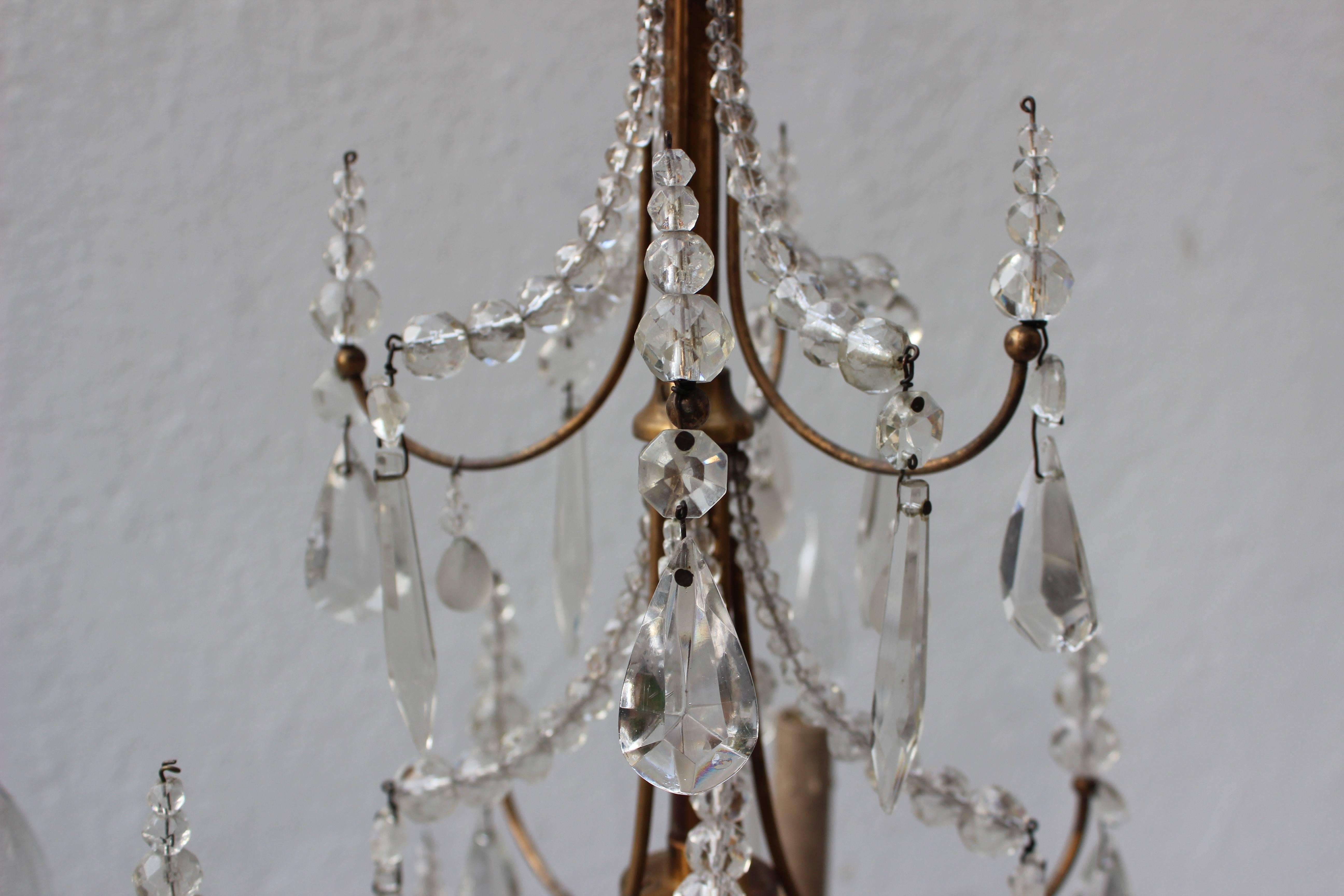 Favoloso lampadario in ottone e cristallo della Maison Jansen.