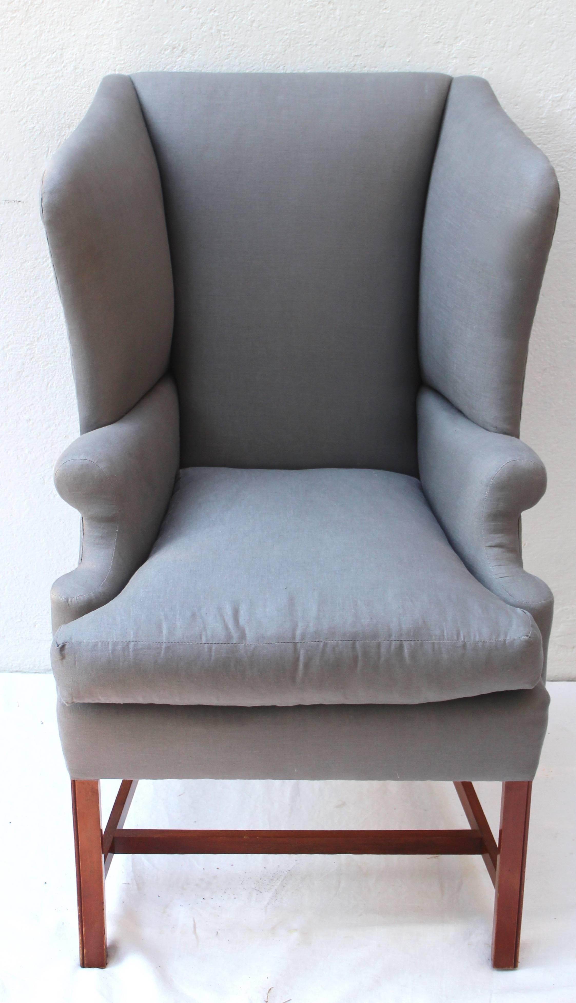 Very special petite Georgian style wingback chair newly upholstered in grey linen.