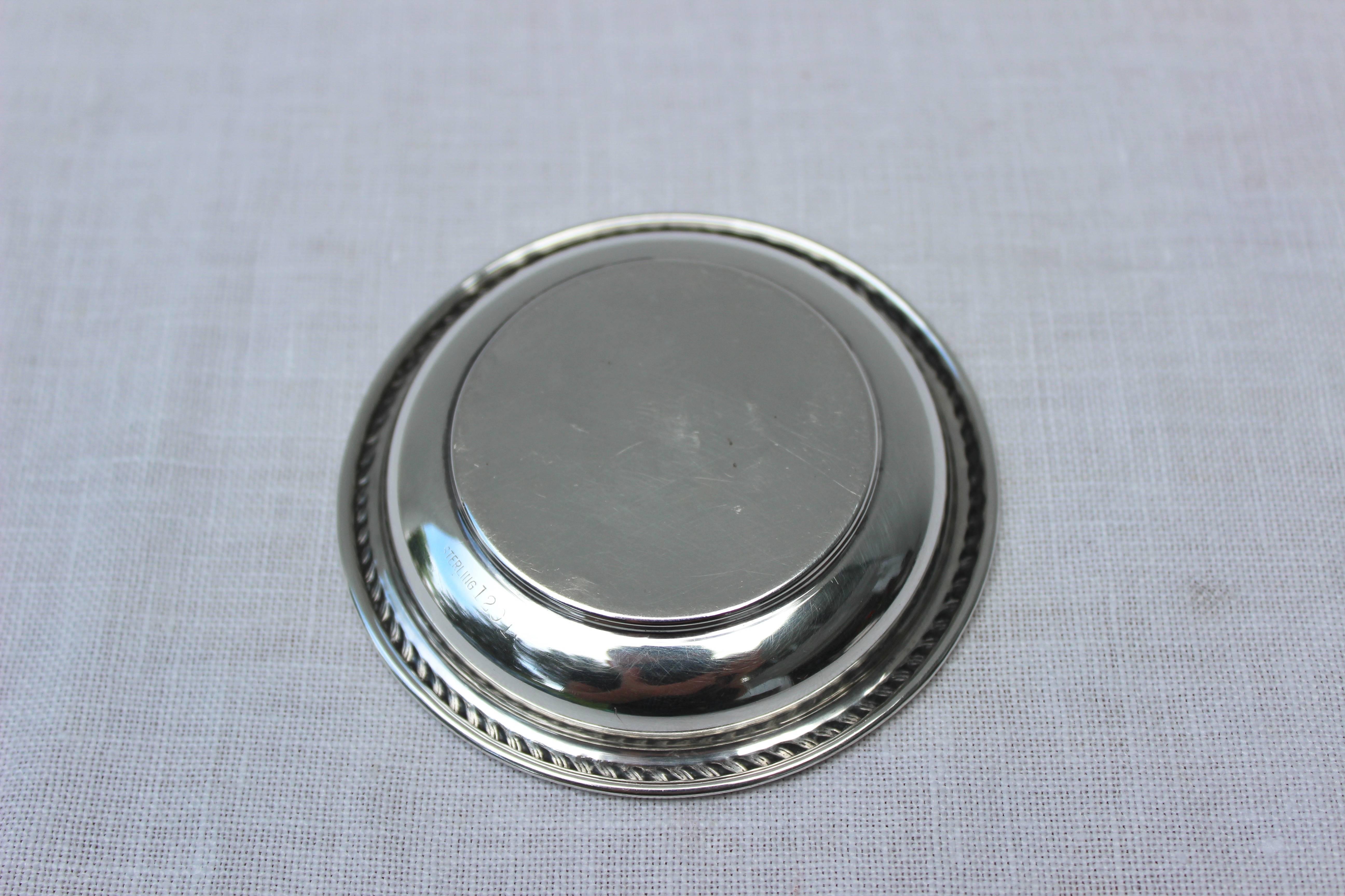 Small sterling silver pin dish with letter R engraved.

Marked Sterling.