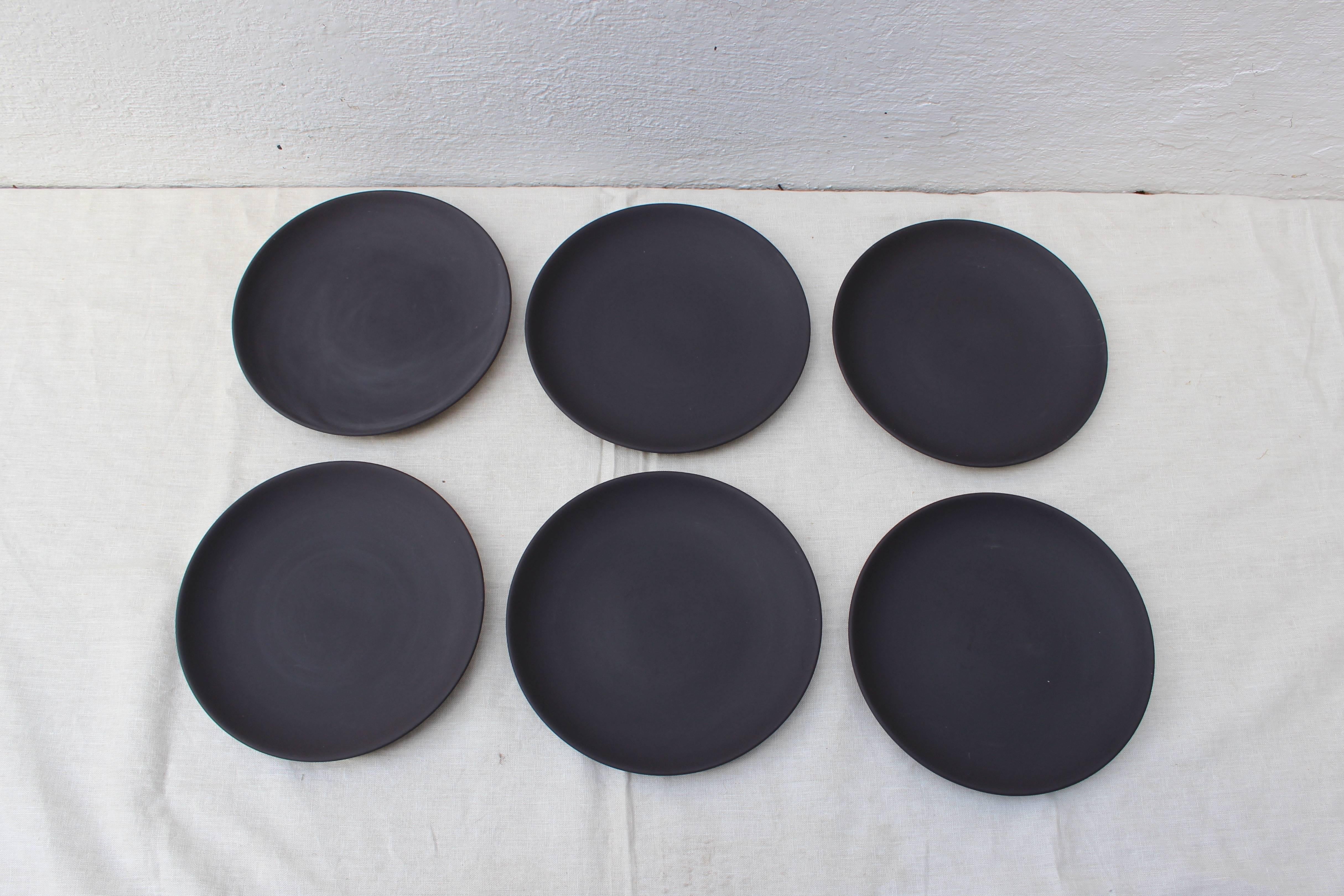 Set of six black basalt salad/ dessert plates.

Each marked on the bottom 