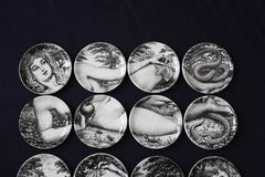 Two Complete Sets of Fornasetti Adam and Eve Coasters