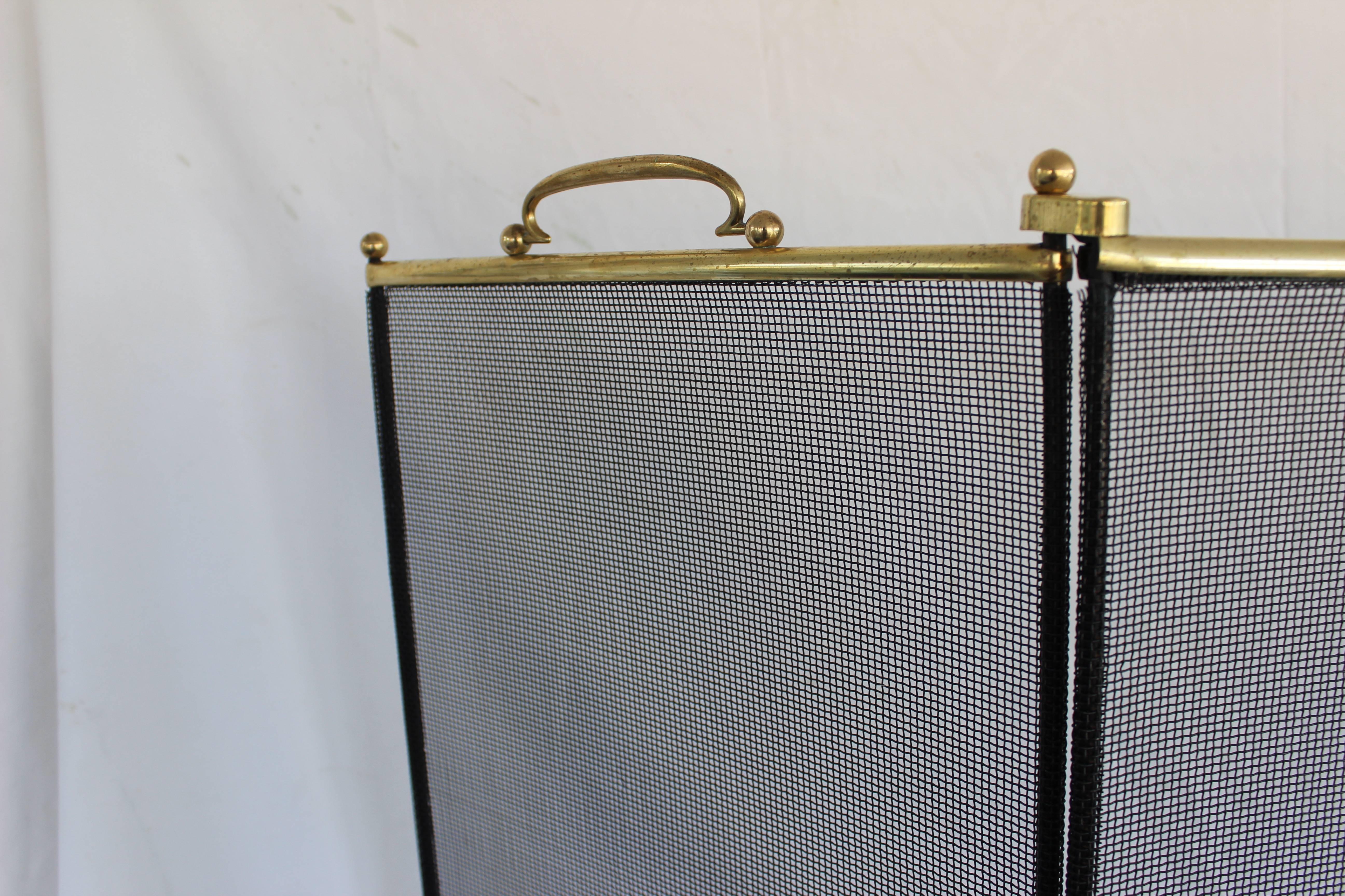 Brass and metal wire mesh fireplace screen

Opened flat measures 51.5
