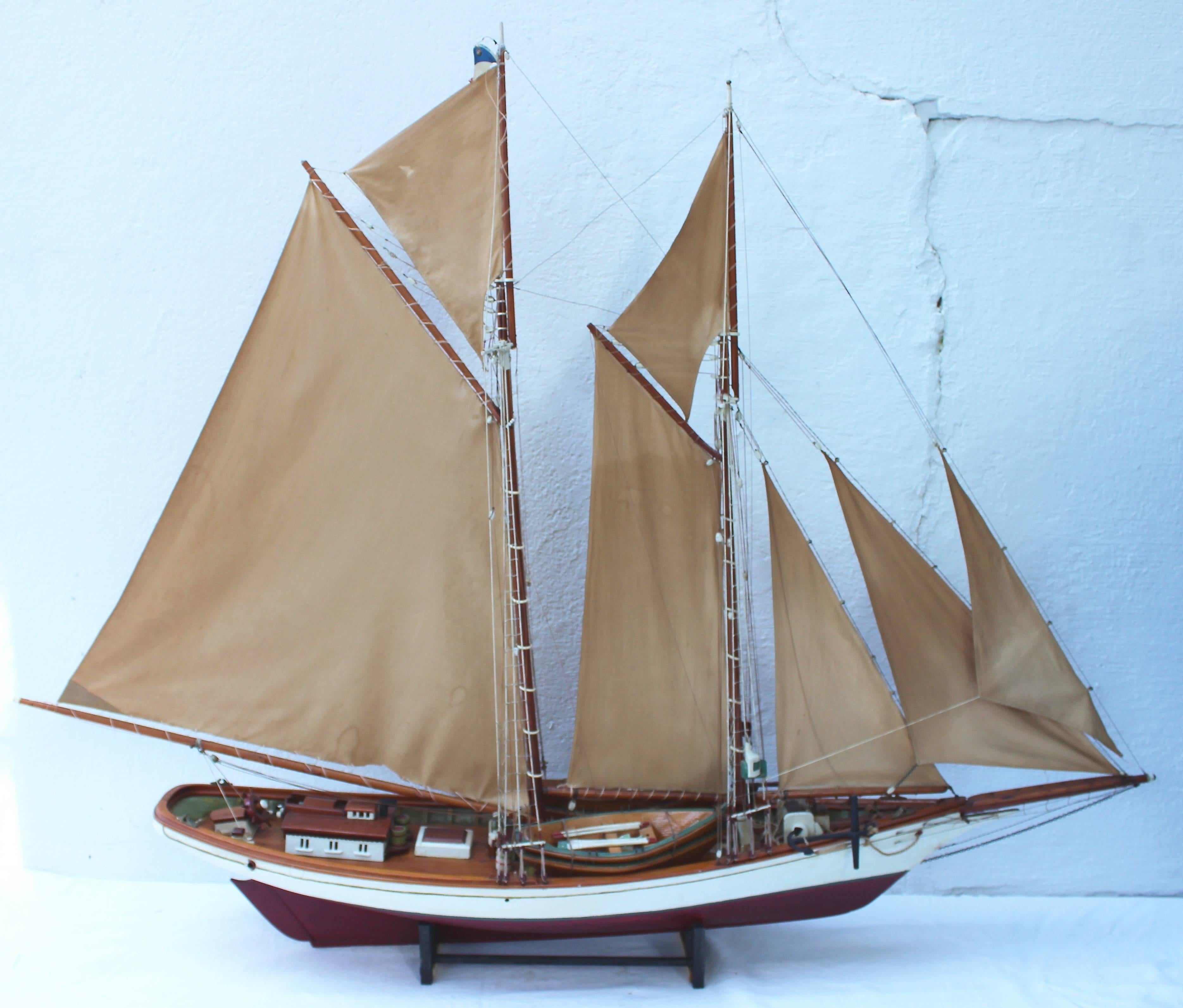Impressive model sailboat from the Philadelphia Seaport Museum with full rigging and sails and painted wood hull.