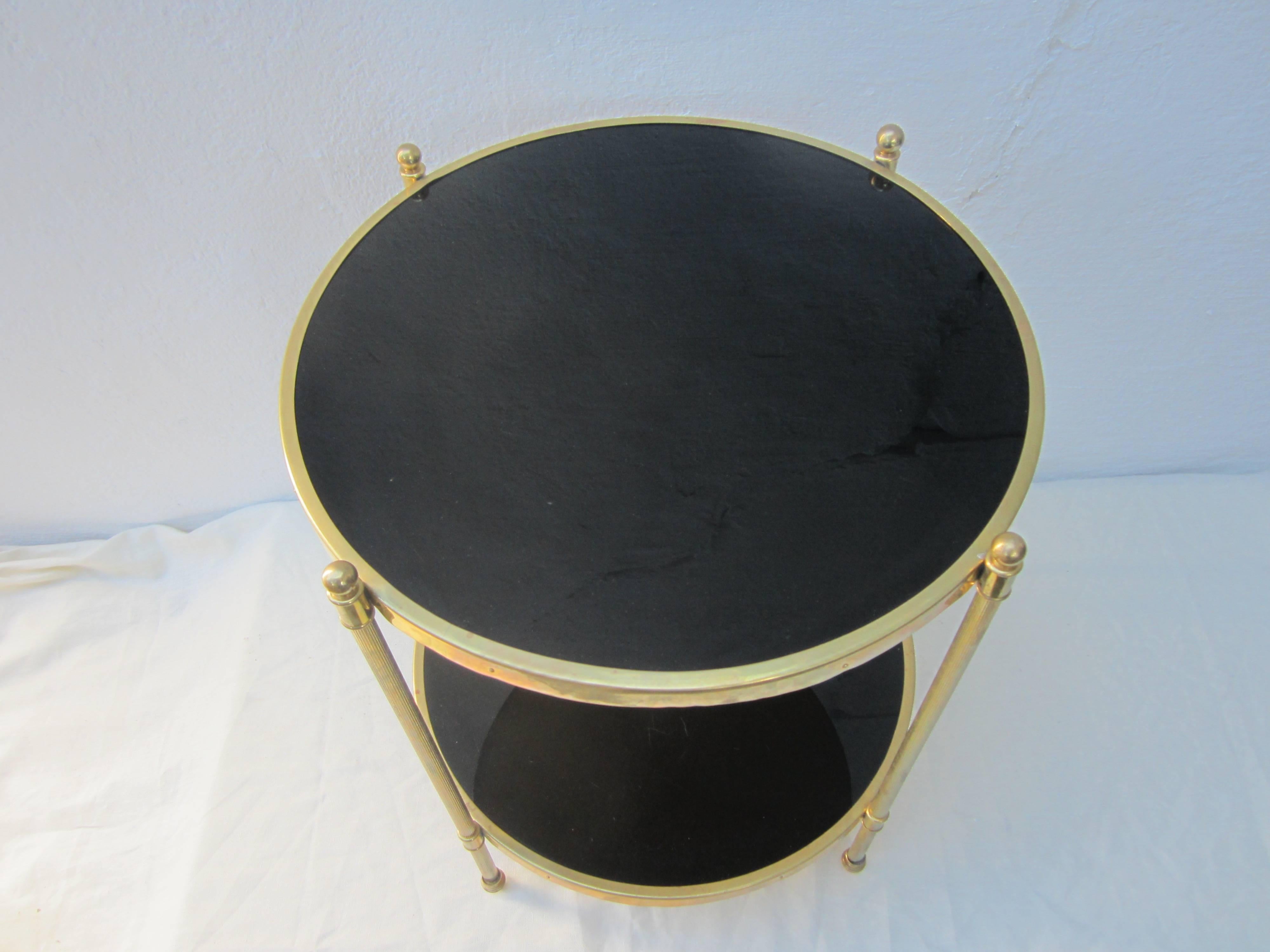 Maison Jansen style side table. Brass frame with black glass.
