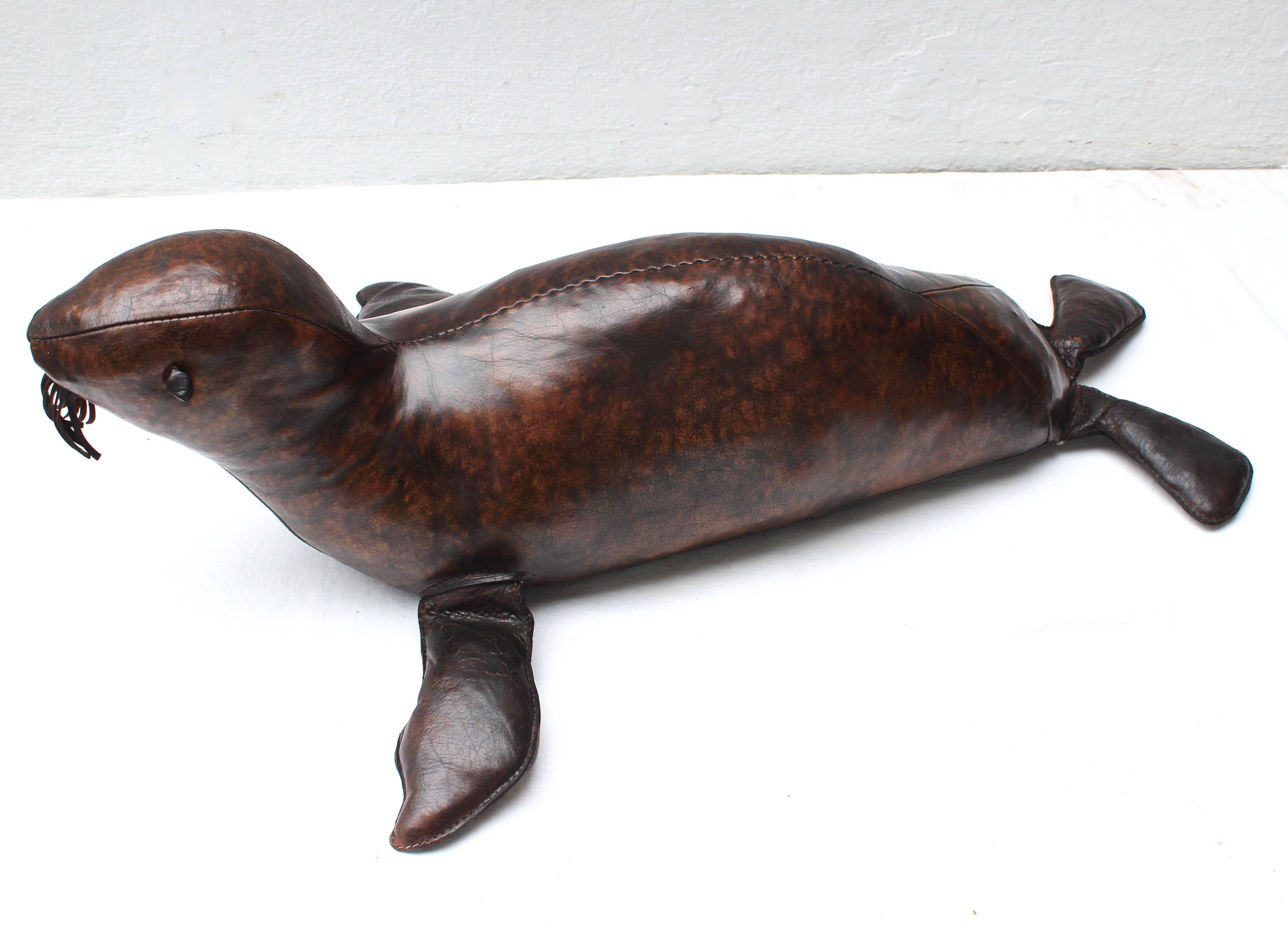 Rare find of an Abercrombie and Fitch leather seal sculpture.