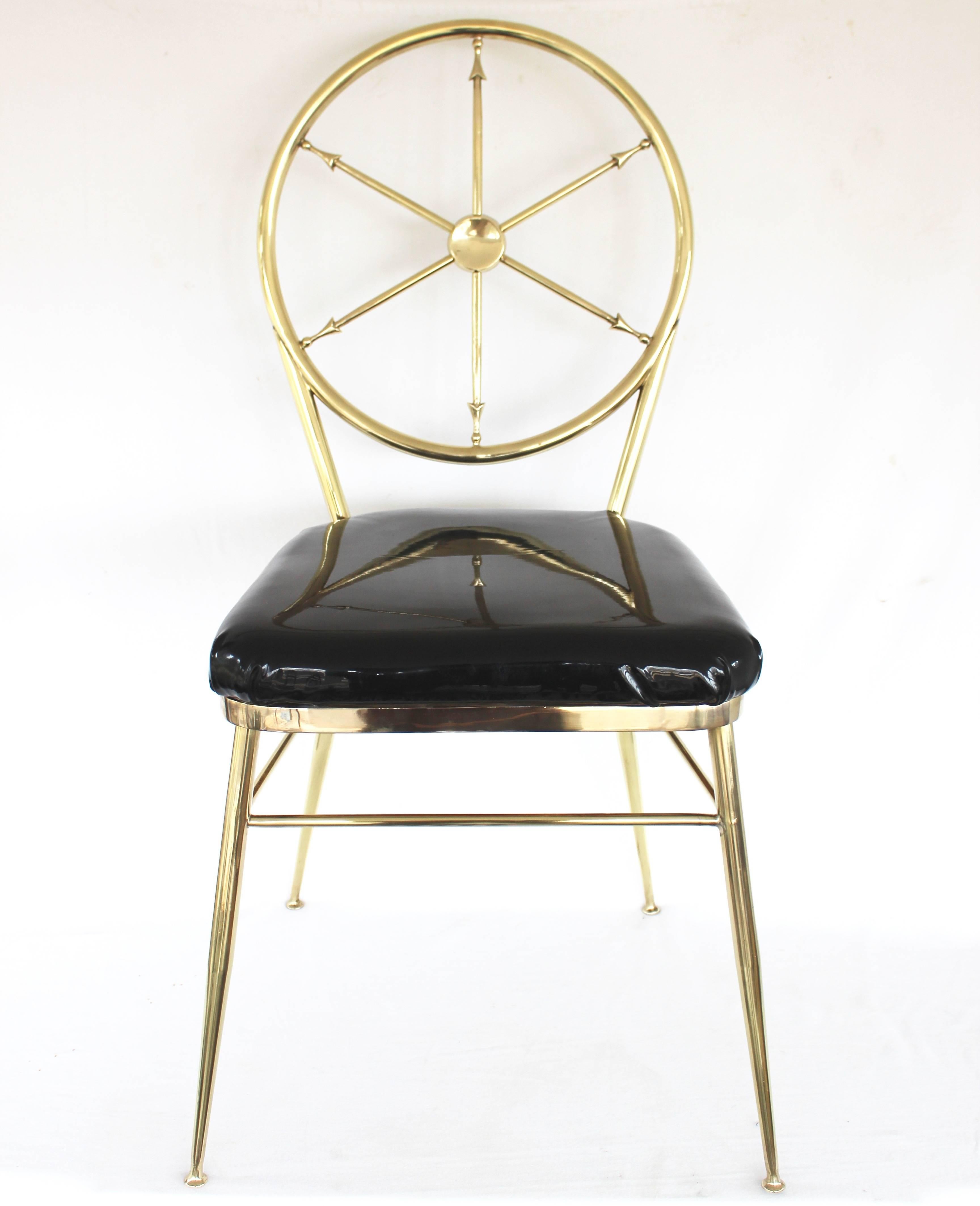 Set of four brass compass back chairs attributed to Gio Ponti two are armchairs and two are side chairs.