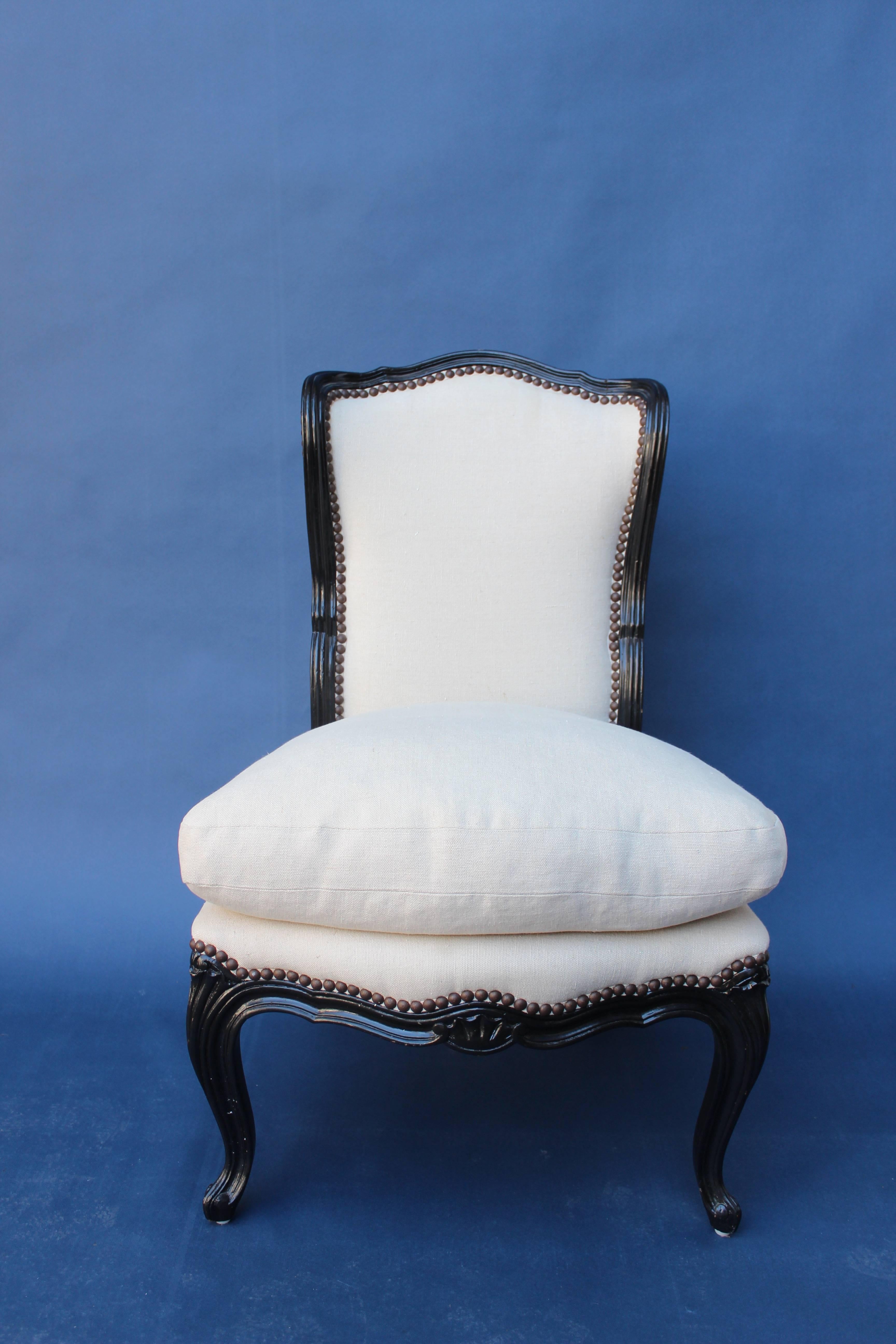 Petit French slipper chair with black painted frame newly reupholstered in linen with all new materials and plump down seat.