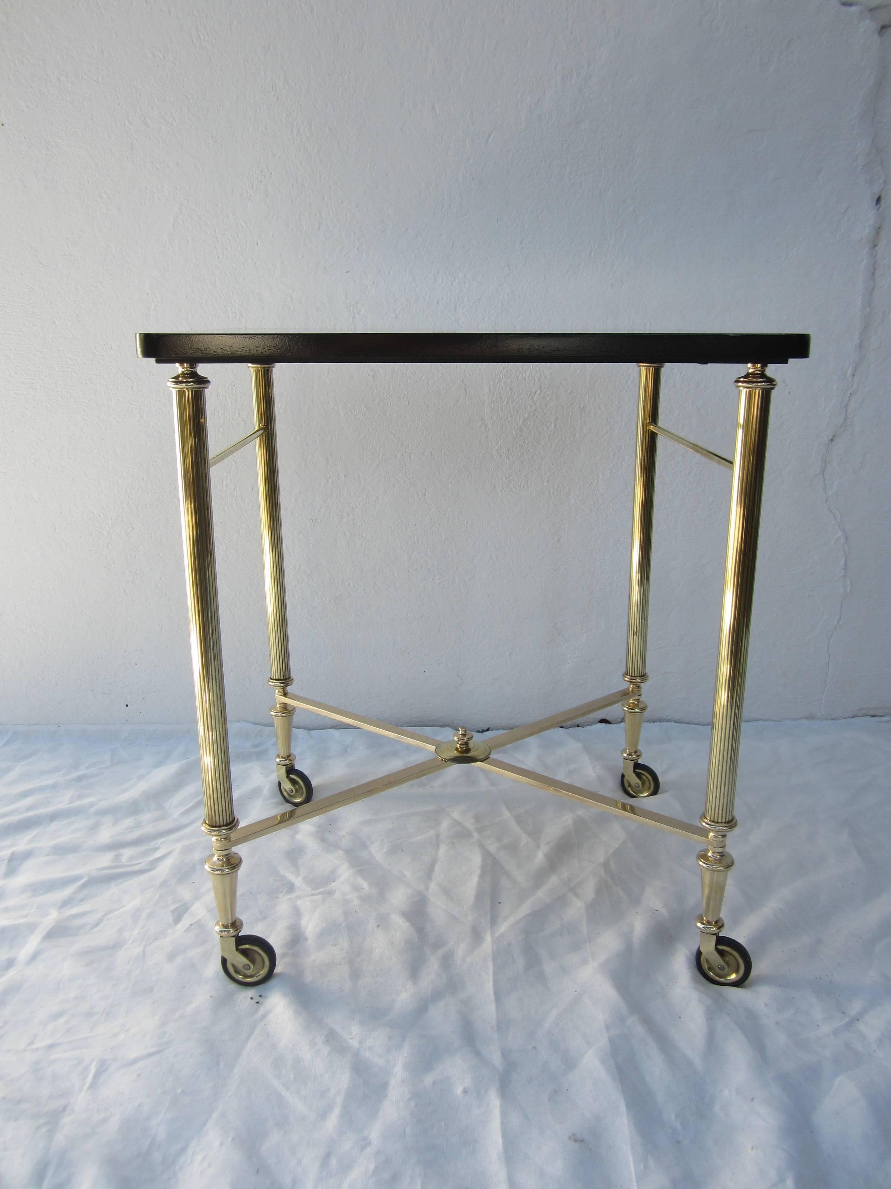 Brass cart with a newly refinished wood top. Can be used as a tea or bar cart as well as a side table.