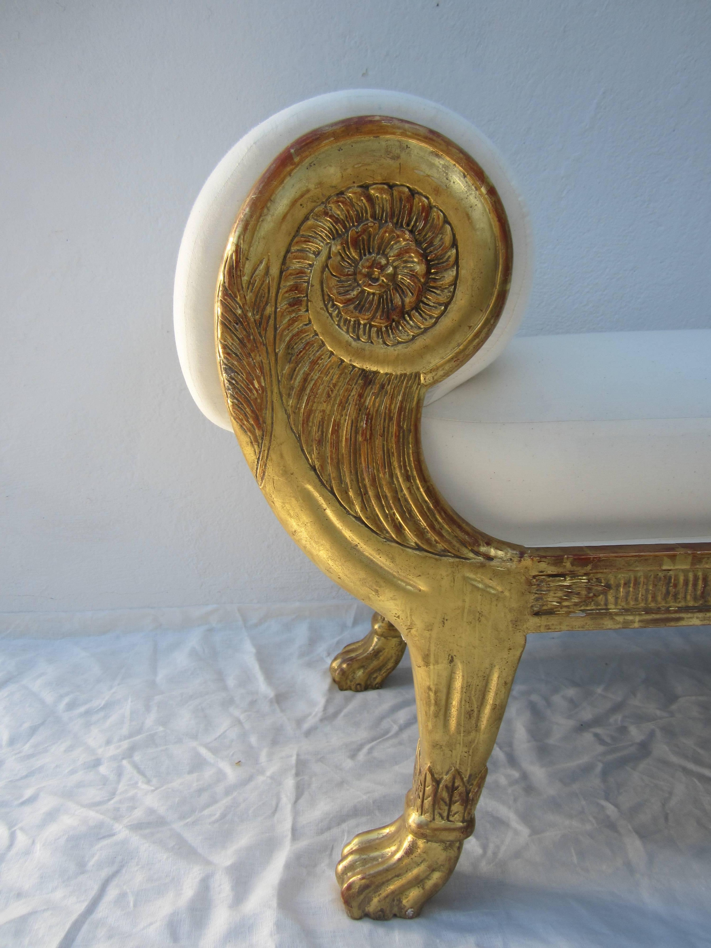 Elegant giltwood bench, wonderful carved paws. Newly re-upholstered in muslin.