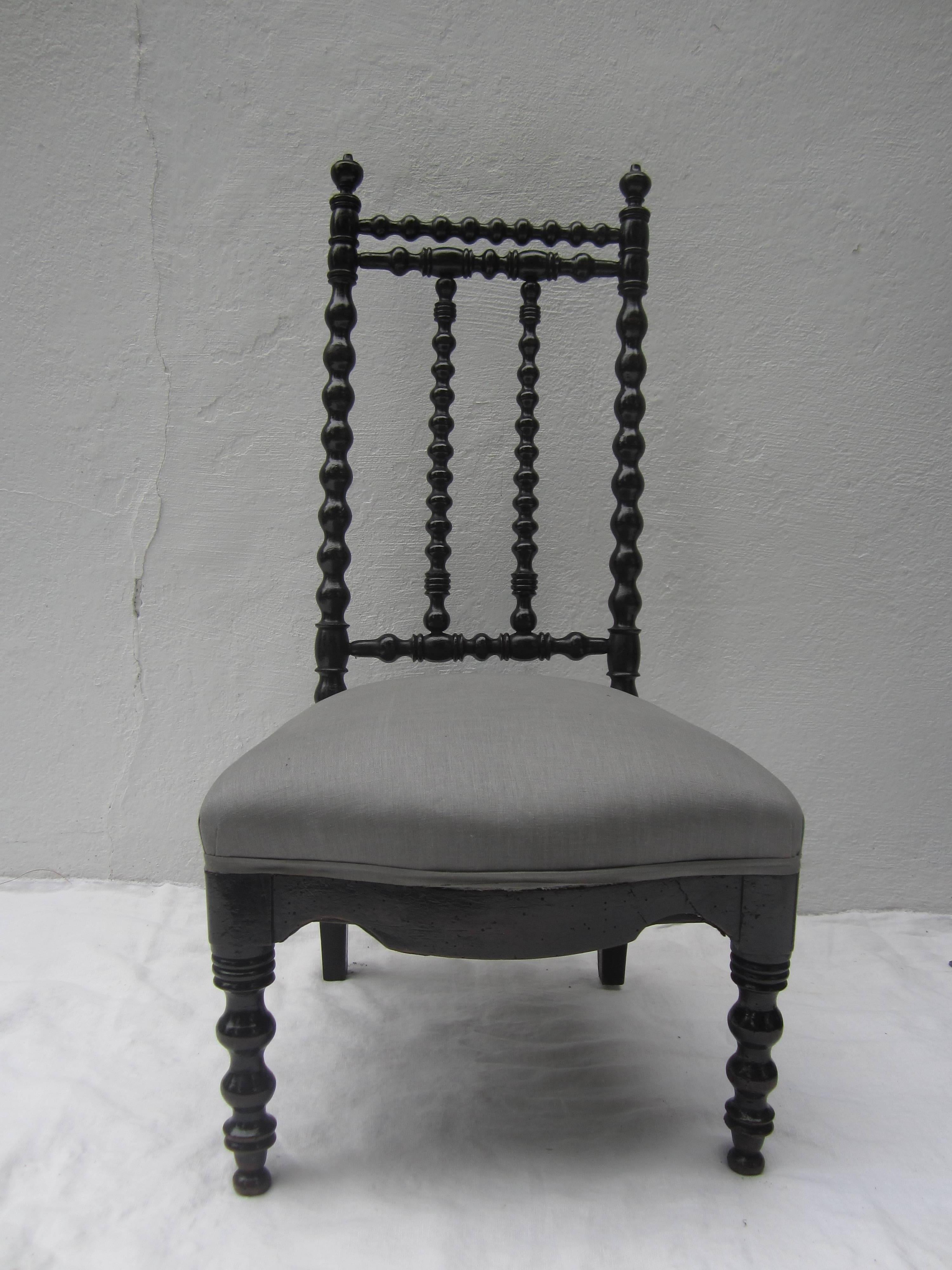 Great looking slipper chair with gray linen upholstery.