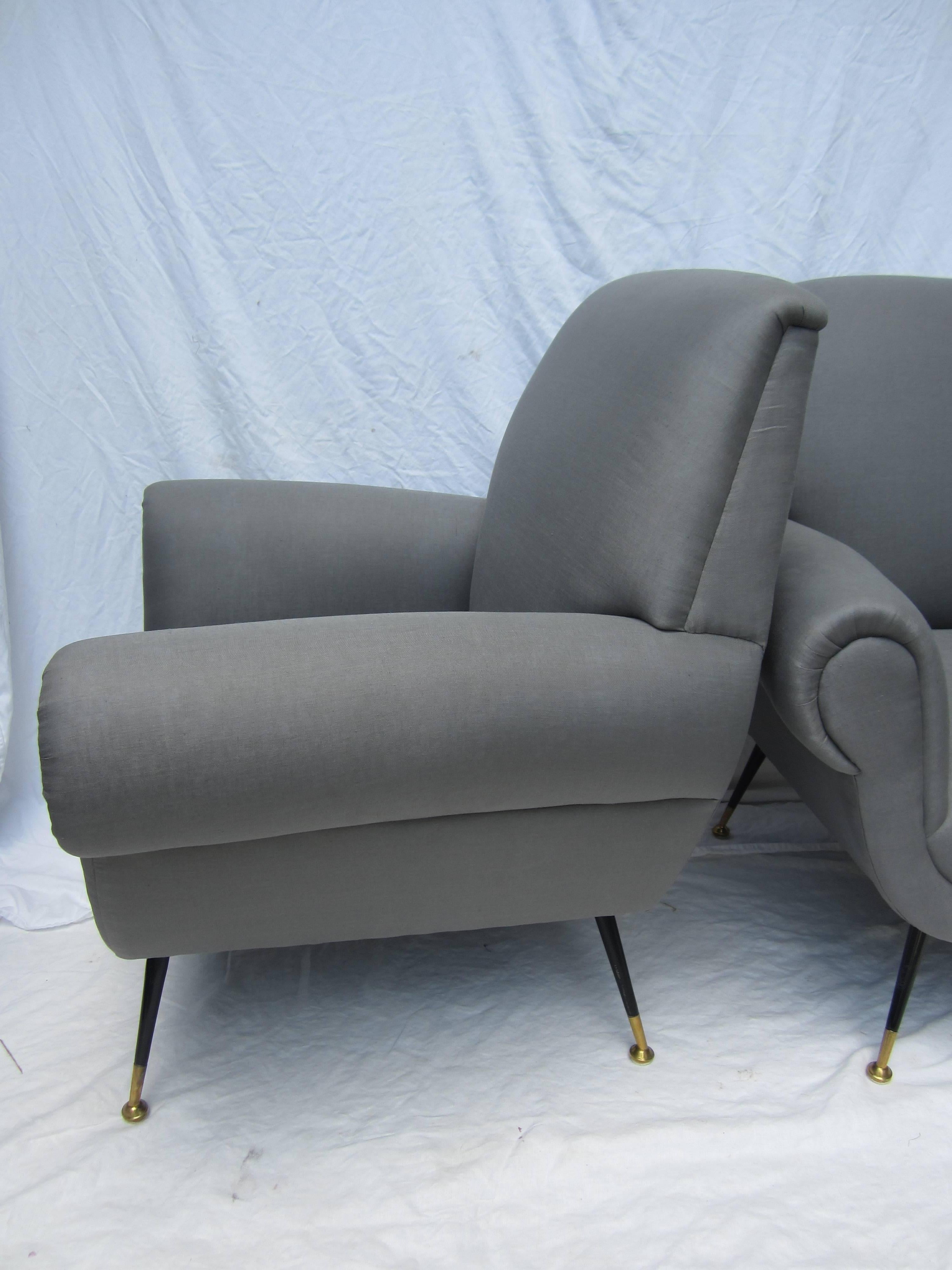 Pair of Italian arm chairs by Gigi Radice for Minotti newly upholstered in gray linen.....steel and brass legs.