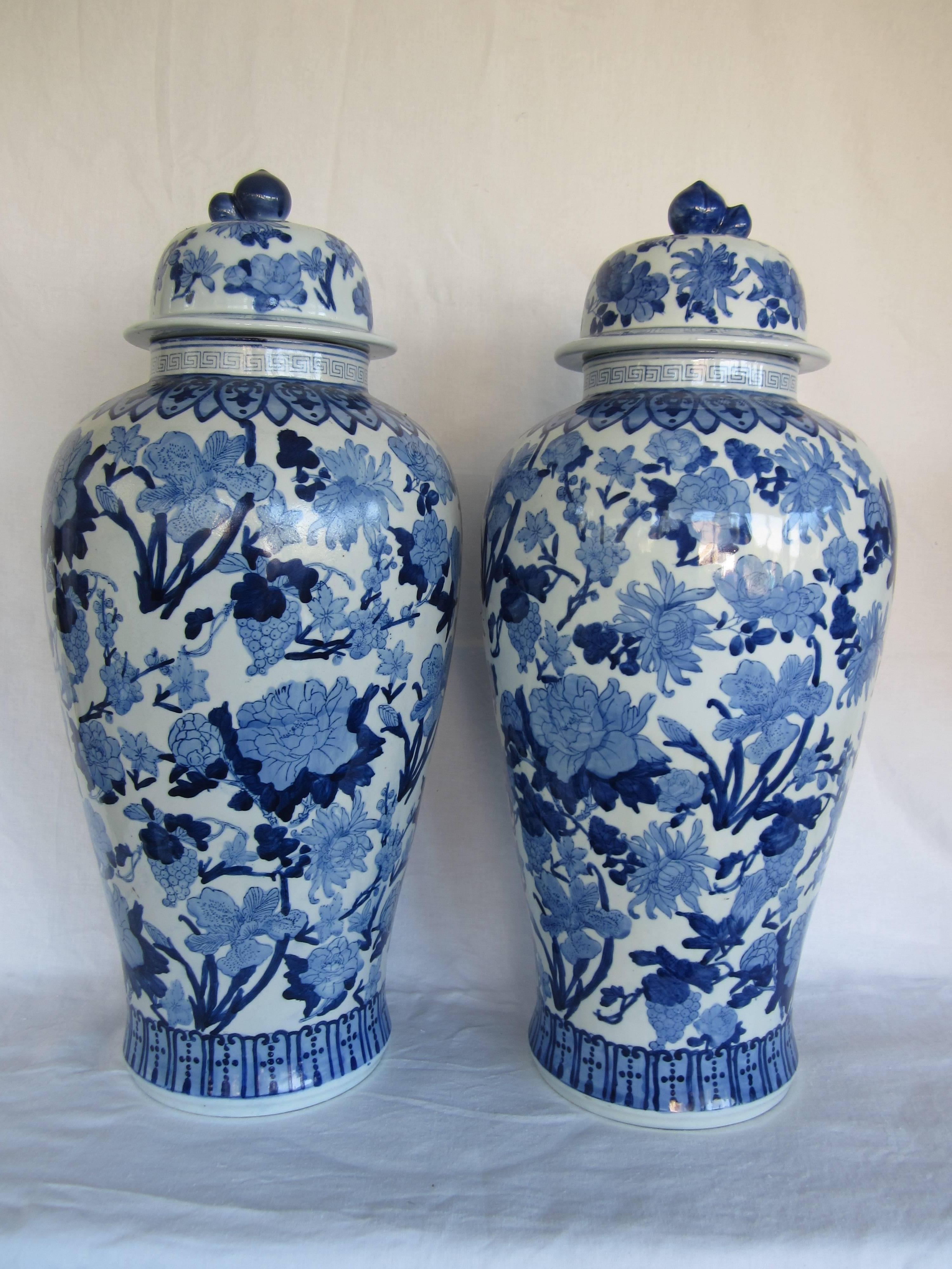 Large pair of Chinese blue and white floral motif baluster vases.