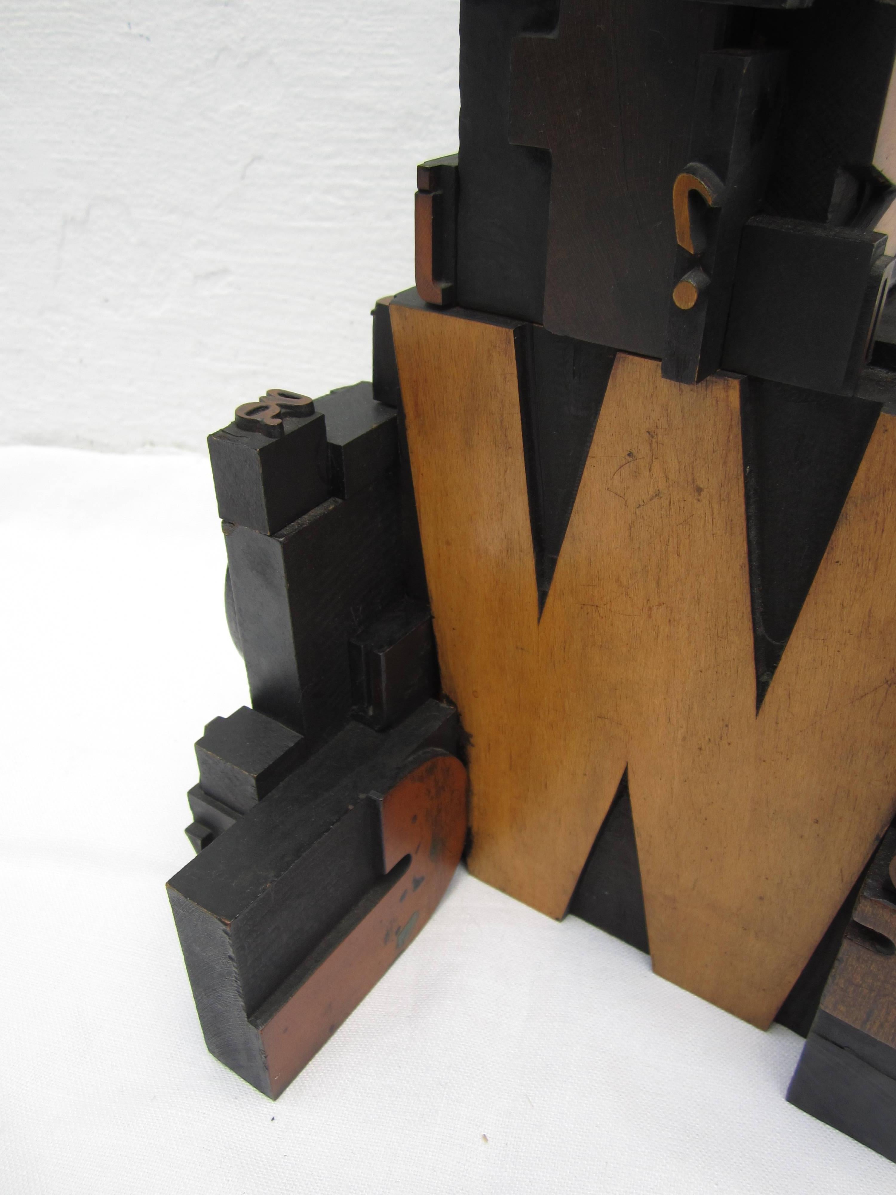 Antique letterpress printers wood block sculpture.