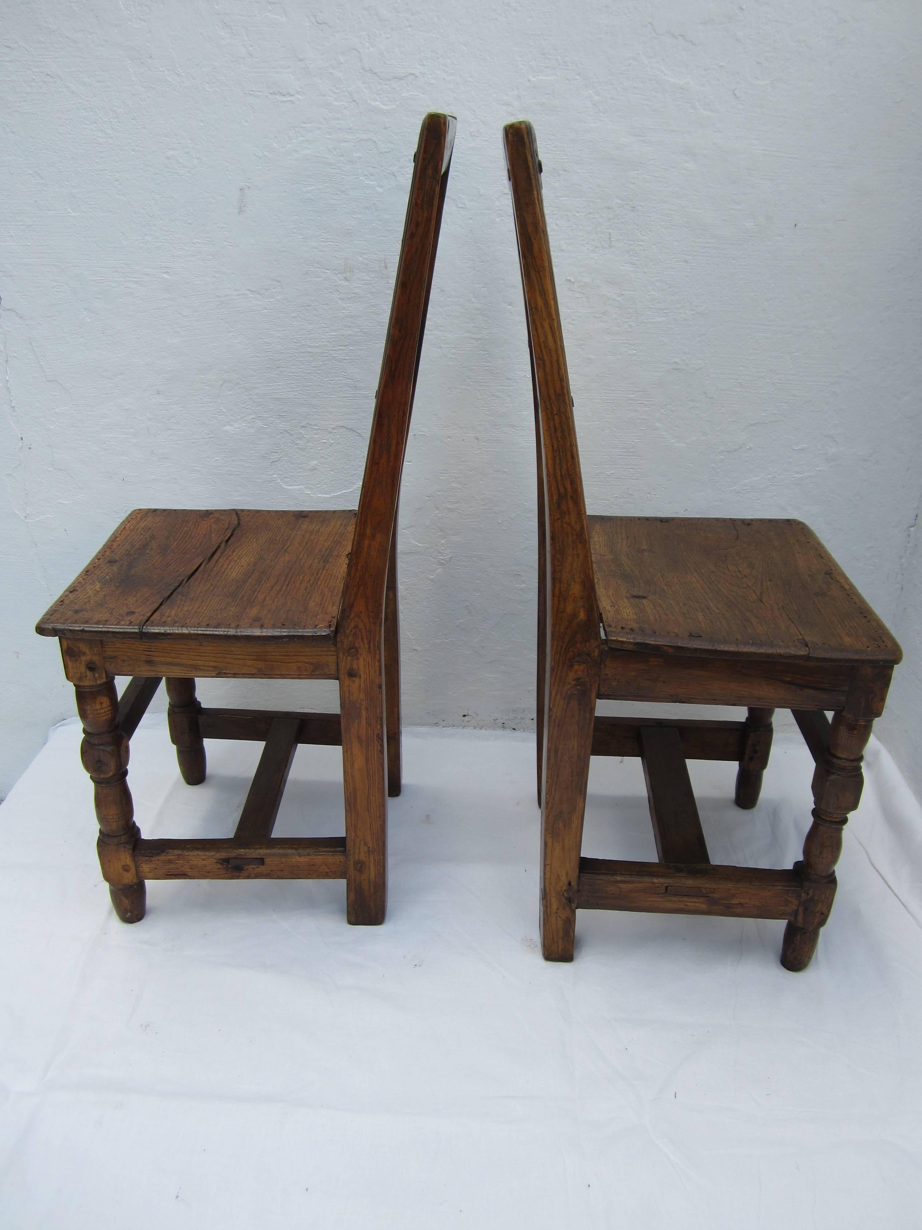 Pair of 17th century French walnut side chairs.