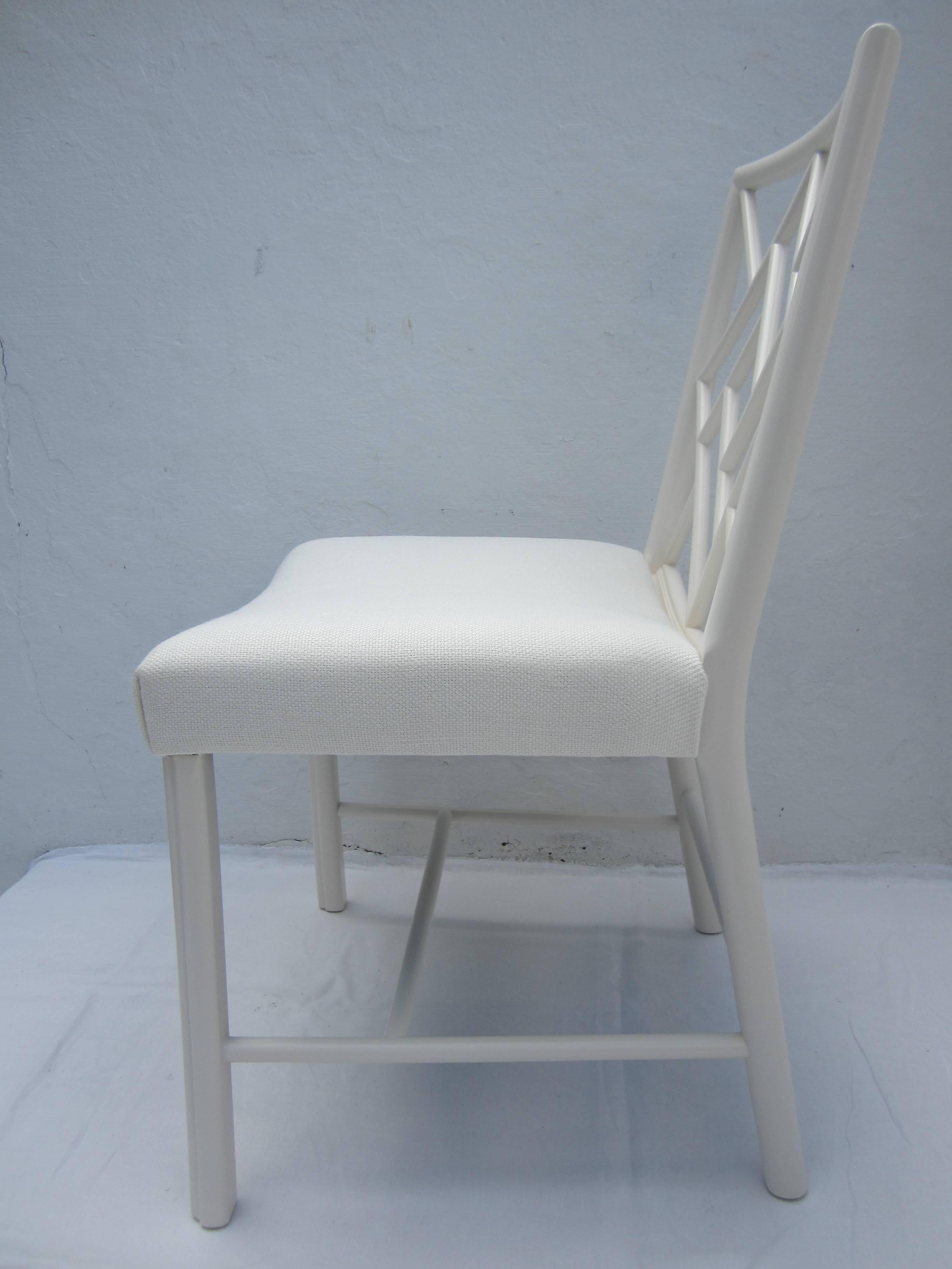 Set of eight Chinese Chippendale dining chairs with lattice back. Painted in off-white Farrow and Ball, color "Clunch." Only one chair is upholstered in fabric shown on picture. The remaining seven chairs are upholstered in muslin.