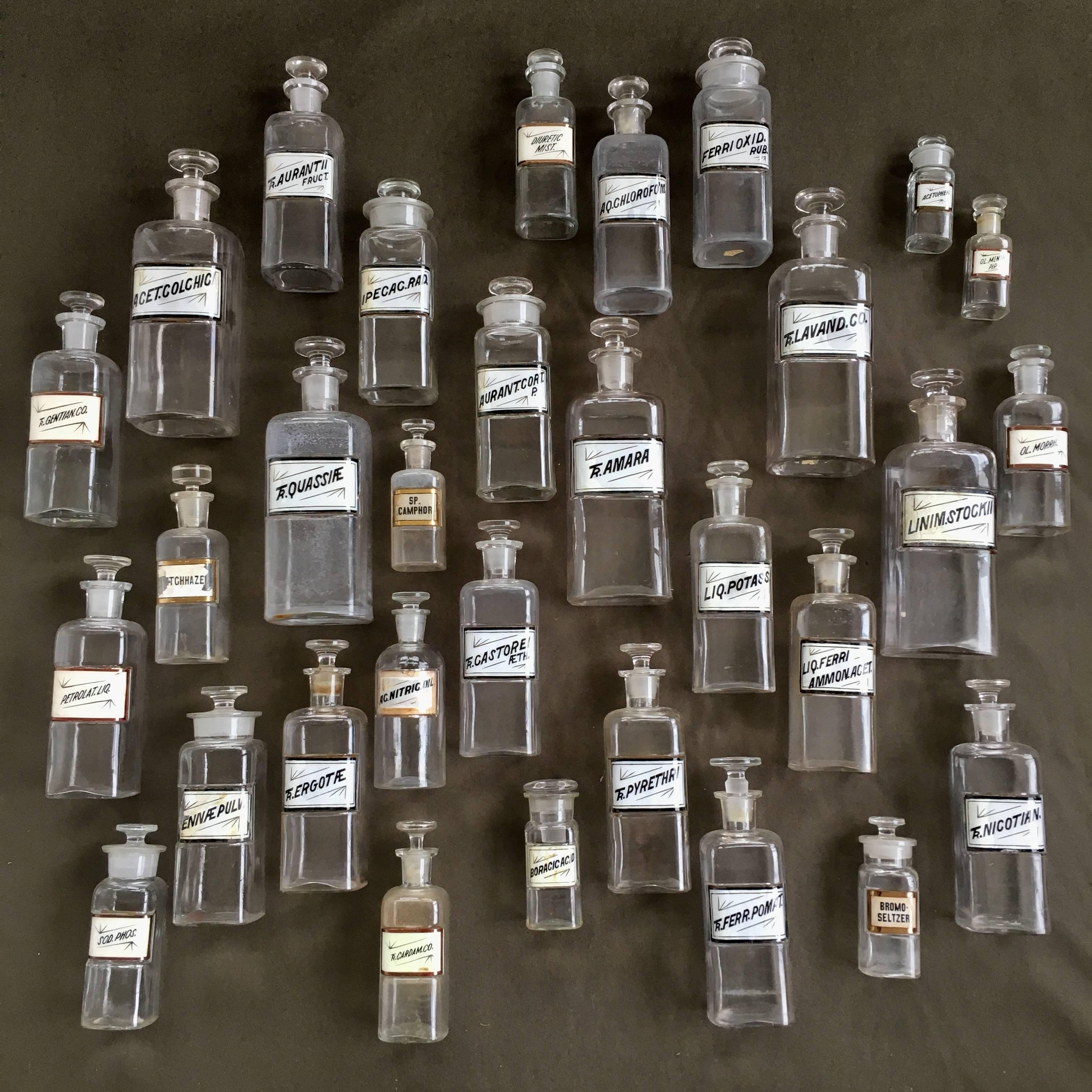 Impressive collection of 31 19th century apothecary bottles. Made in the USA in 1889 (each marked on the bottom).
Largest measures: 9.75" H x 3.5" W x 3.25" D.
Smallest measures: 4" H x 1.5" W x 1.5" D.