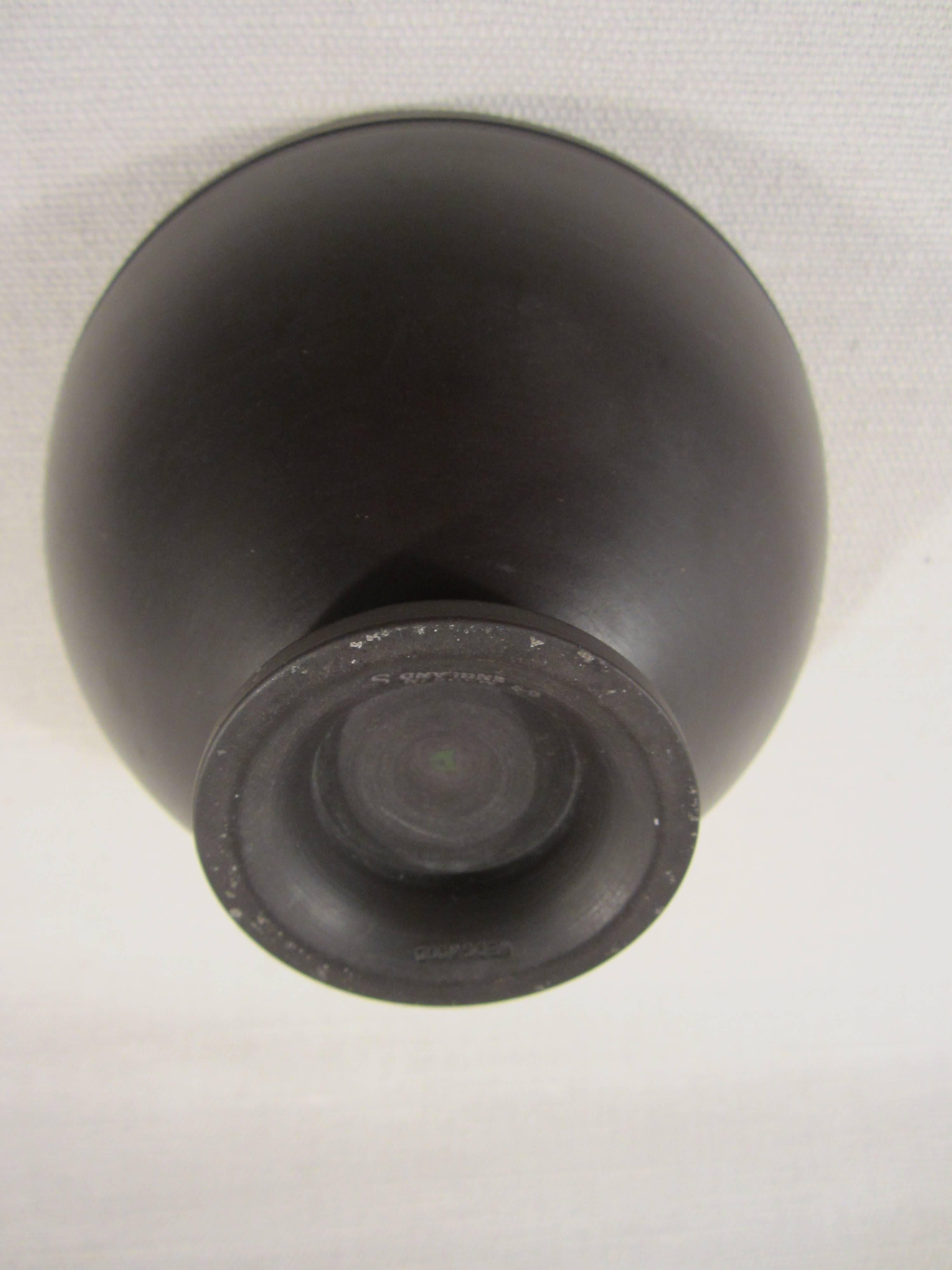 Basalt Wedgwood bowl.

Marks: "Wedgwood", "64 Made in England S, "D" by Keith Murray.
