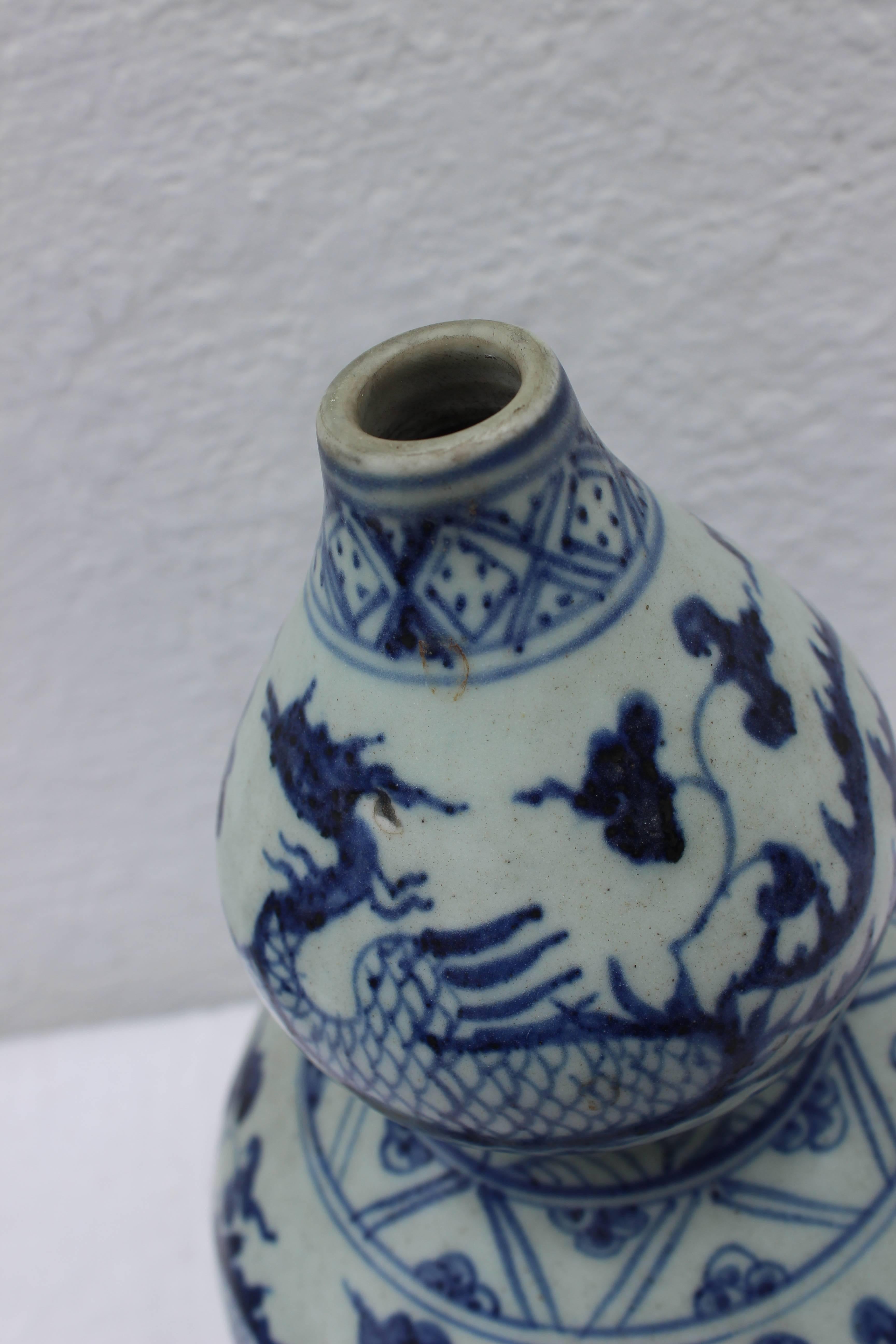 19th century Chinese blue and white gourd shape bud vase.