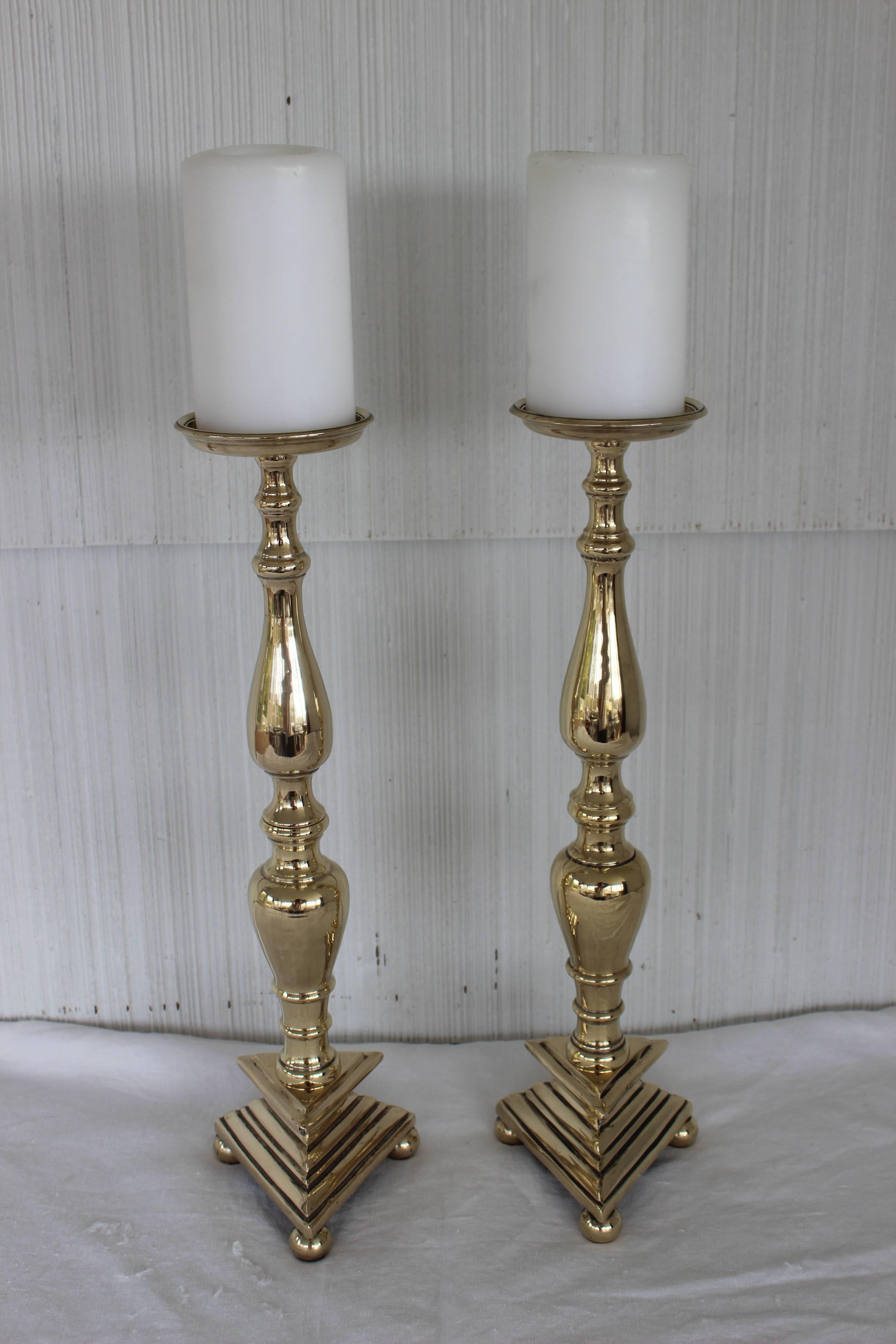Wonderful pair of polished brass altar candlesticks.