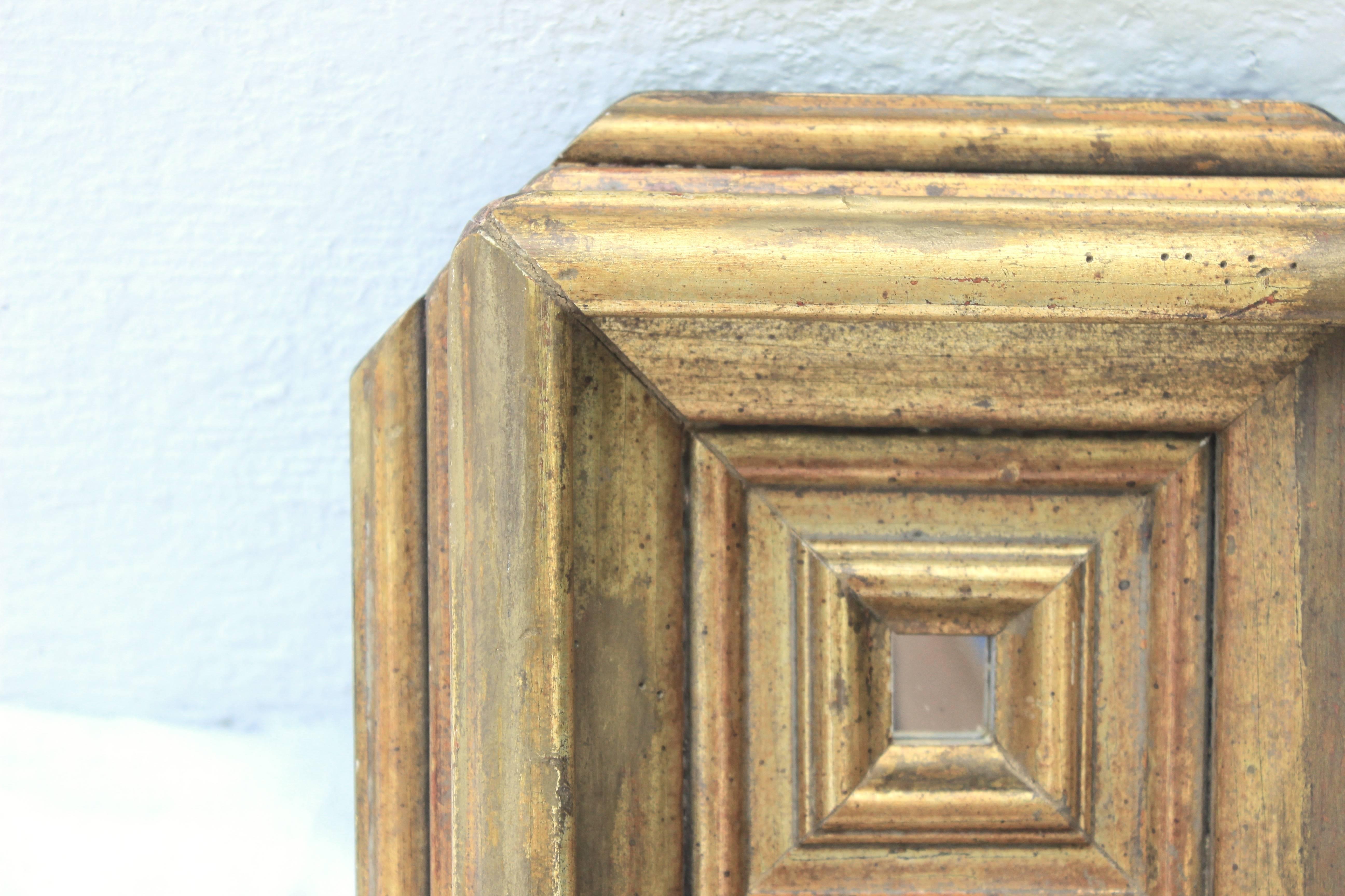 Small Baroque style carved giltwood mirror.